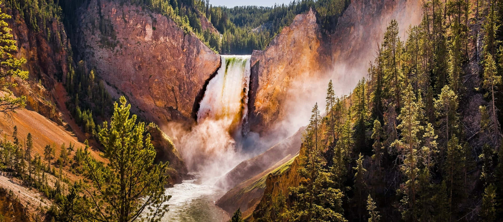 Enjoy The Grand Geyser At Yellowstone National Park Background