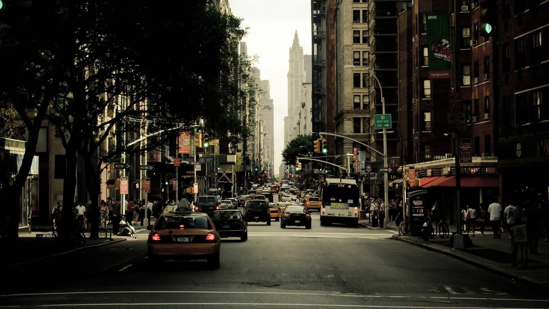 Enjoy The Hustle And Bustle Of New York City On A Lively Street In The City Background