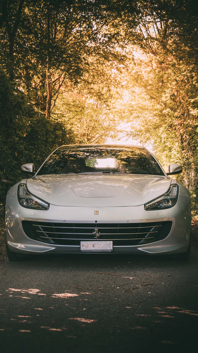 Enjoy The Luxury Of A White Ferrari Iphone Background