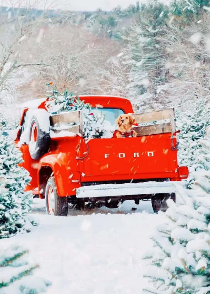 Enjoy The Magical Holiday Spirit With A Vintage Truck Christmas Background