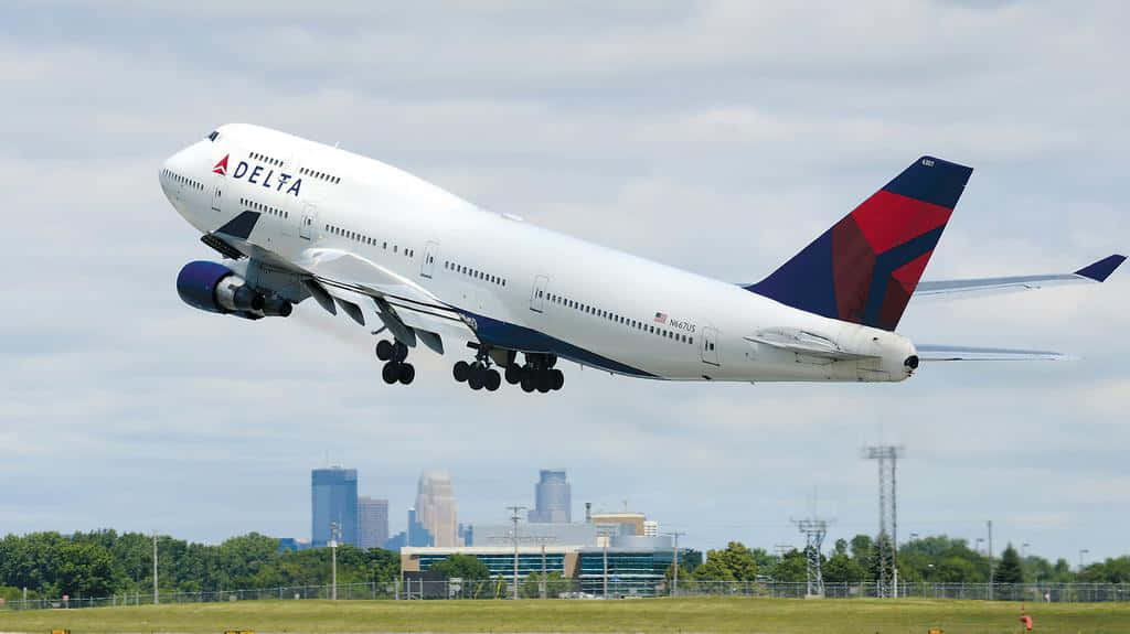 Enjoy The Panoramic View Of A Jumbo Jet Background