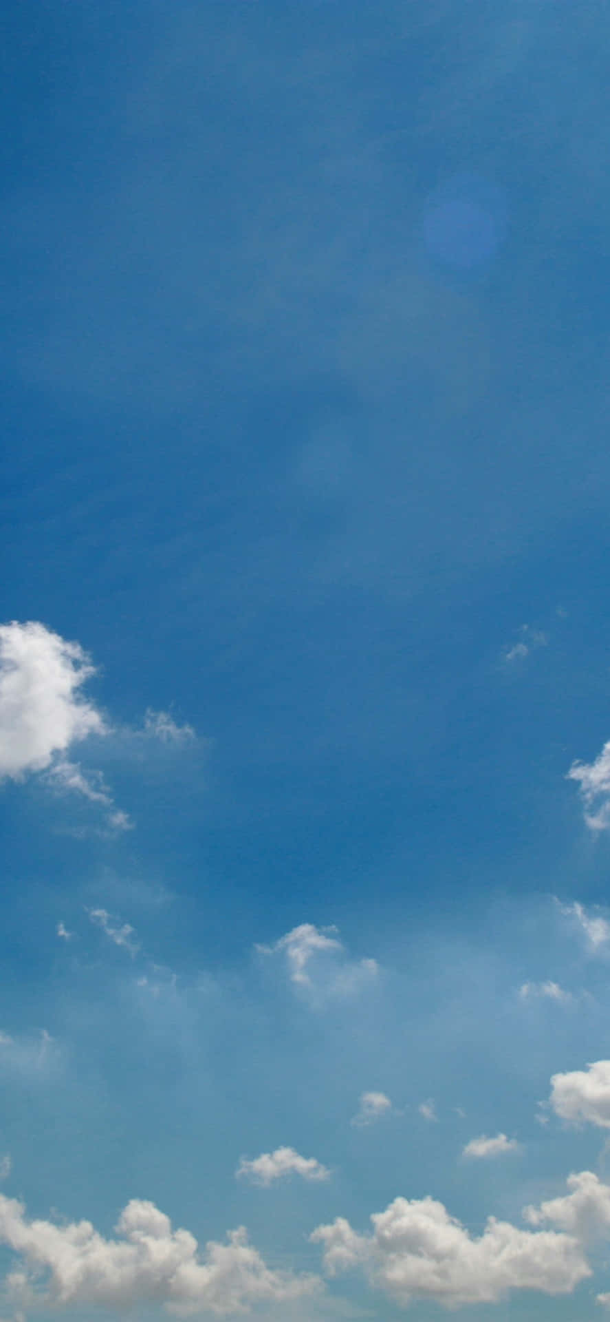 Enjoy The Peaceful Blue Skies With White Clouds Background