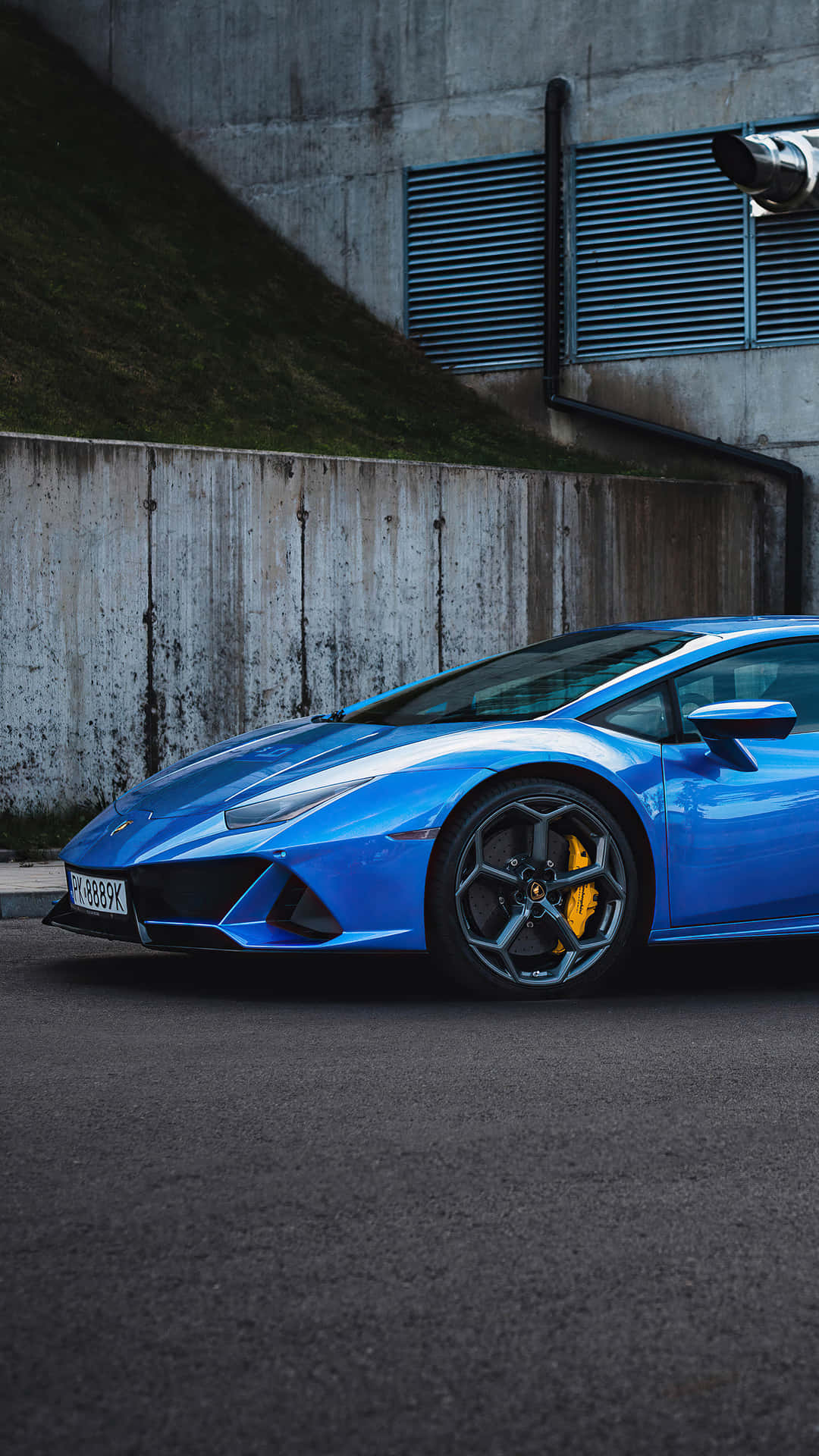 Enjoy The Ride Of Luxury In A Blue Lamborghini Background