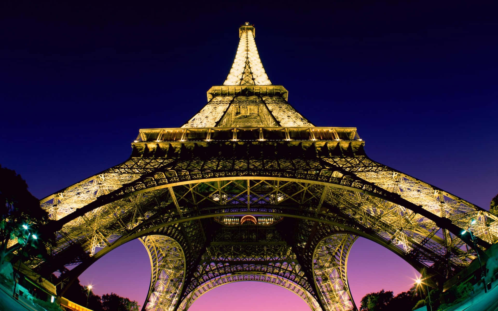 Enjoy The Romantic Lights Of Paris At Night Background