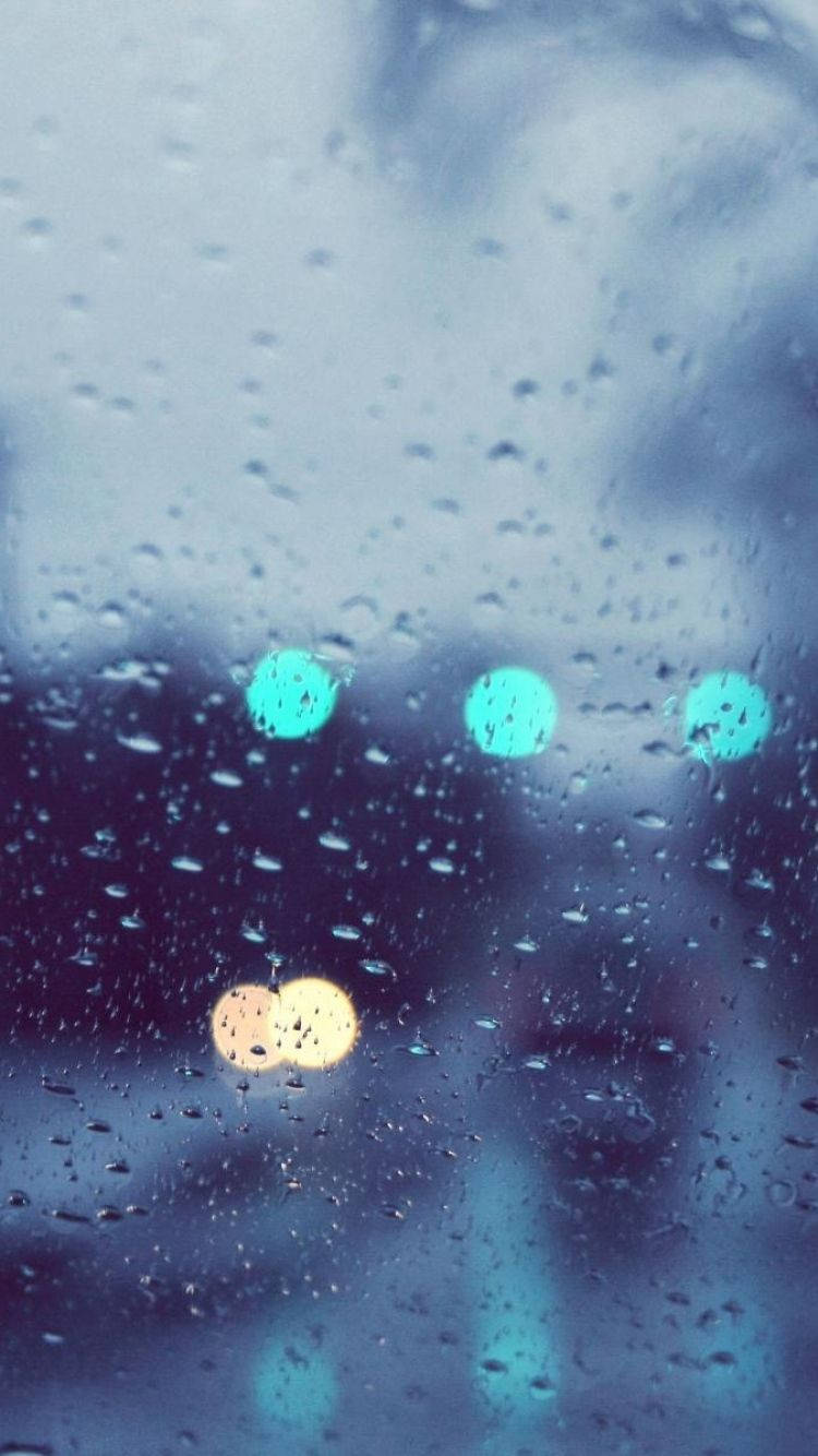 Enjoy The Serene Moment Of The Rain With Your Iphone Background