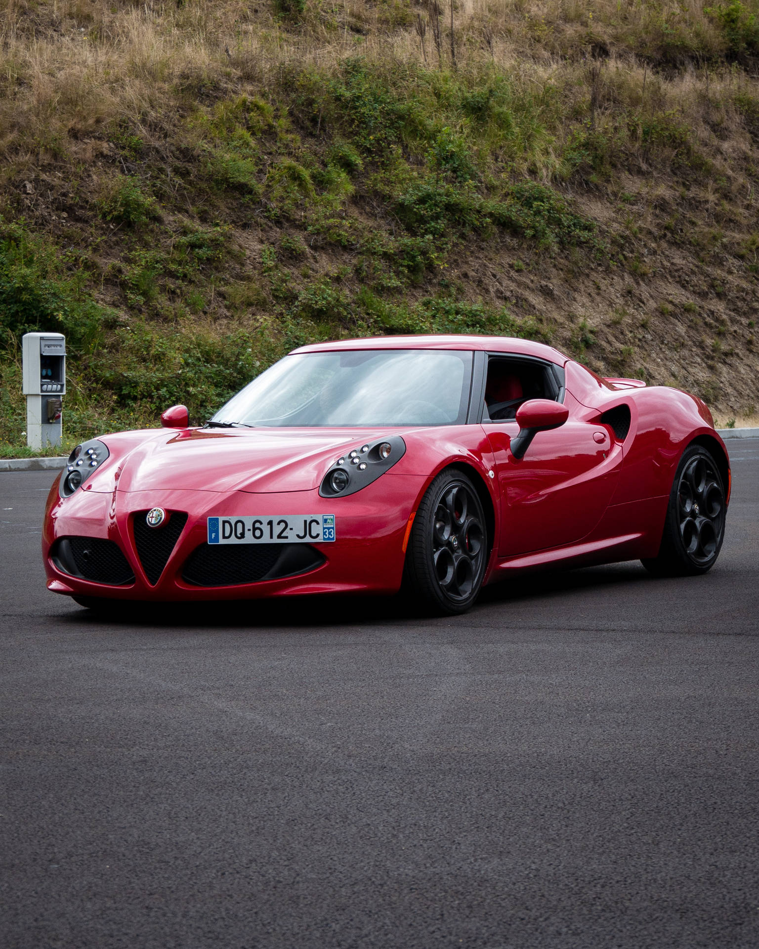 Enjoy The Sleek Style Of The Iconic Red Alfa Romeo 8 C Competizione Background