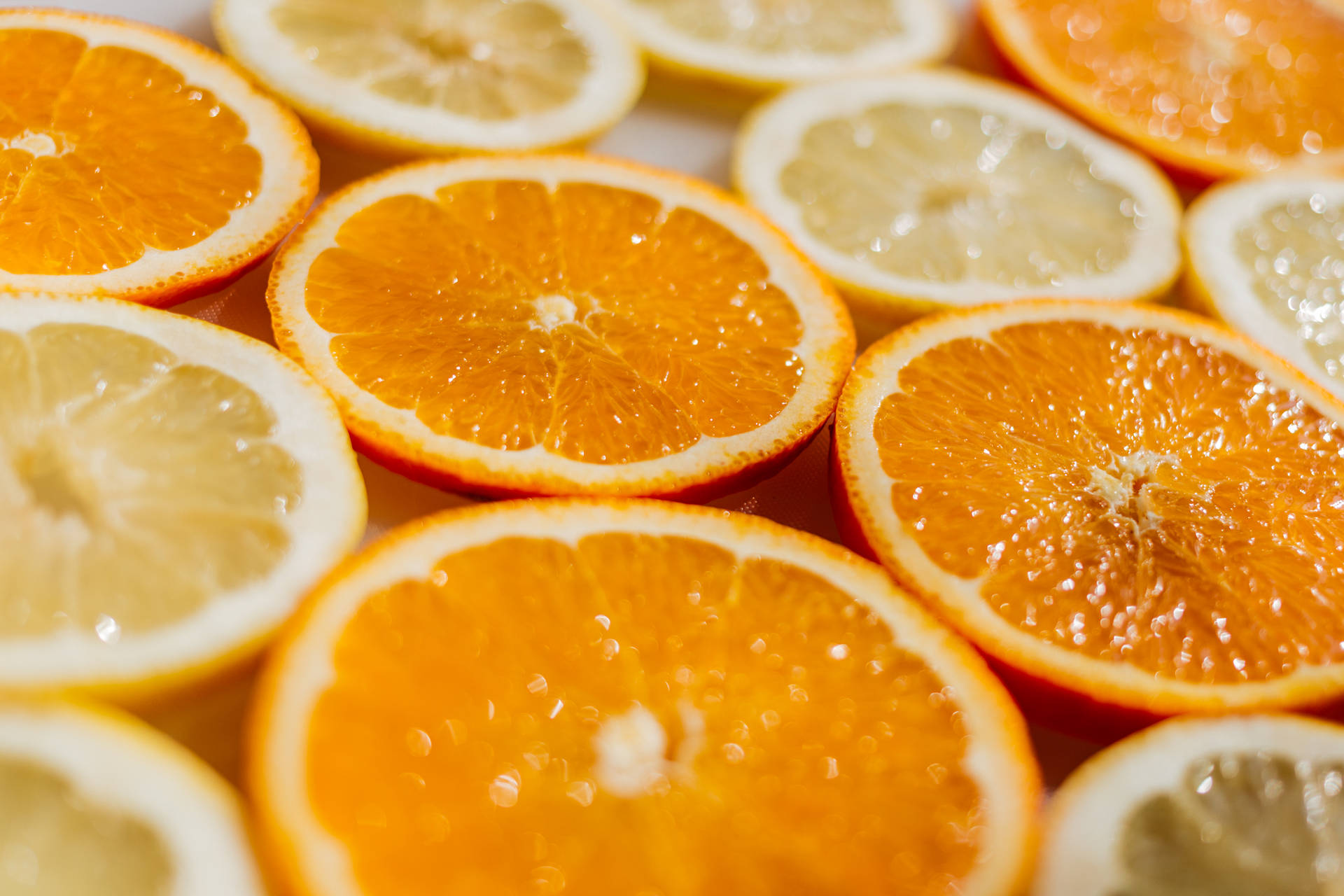 Enjoy The Sweet And Sour Delight Of Orange And Lemon Slices! Background