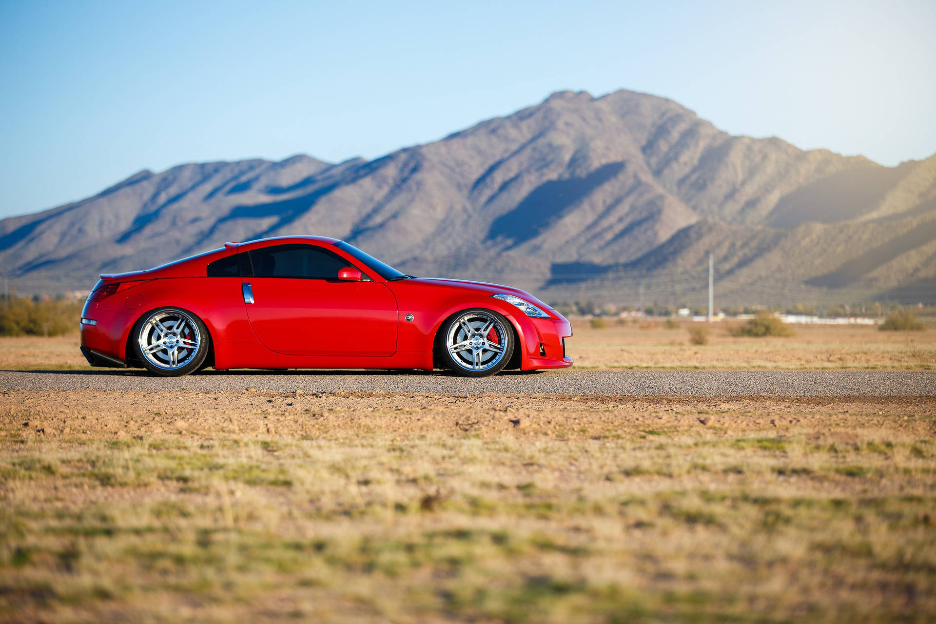 “enjoy The Thrill Of The Drive With The Powerful Nissan 350z” Background