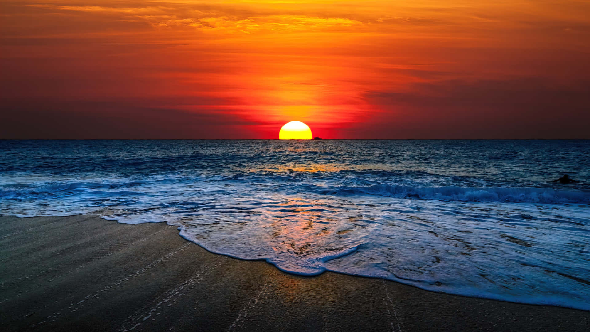 Enjoy The Tranquility Of The Ocean As The Sun Sets Background