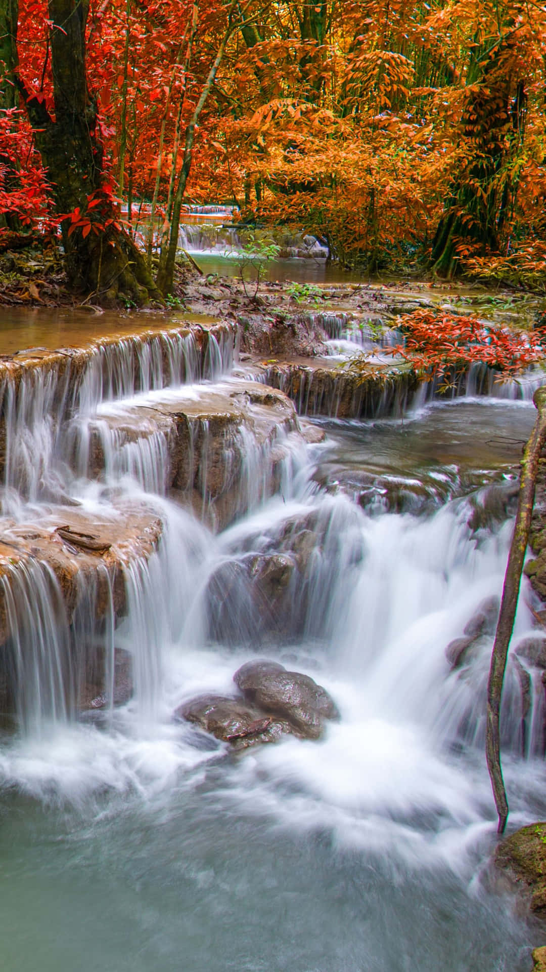 Enjoy The Tranquillity Of An Iphone Waterfall Background