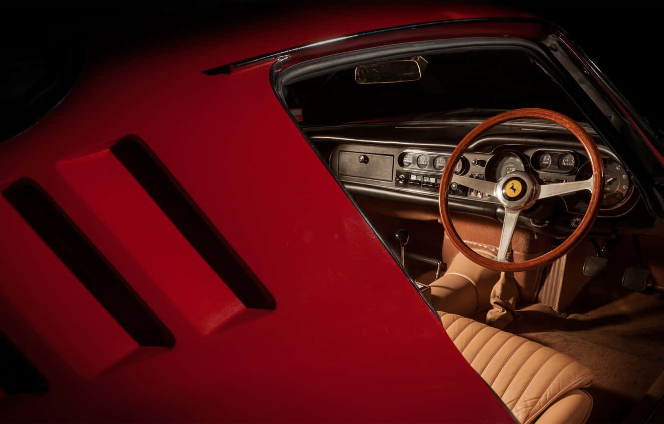 Enjoy The Unique Vintage Luxury Of A Classic Ferrari Background
