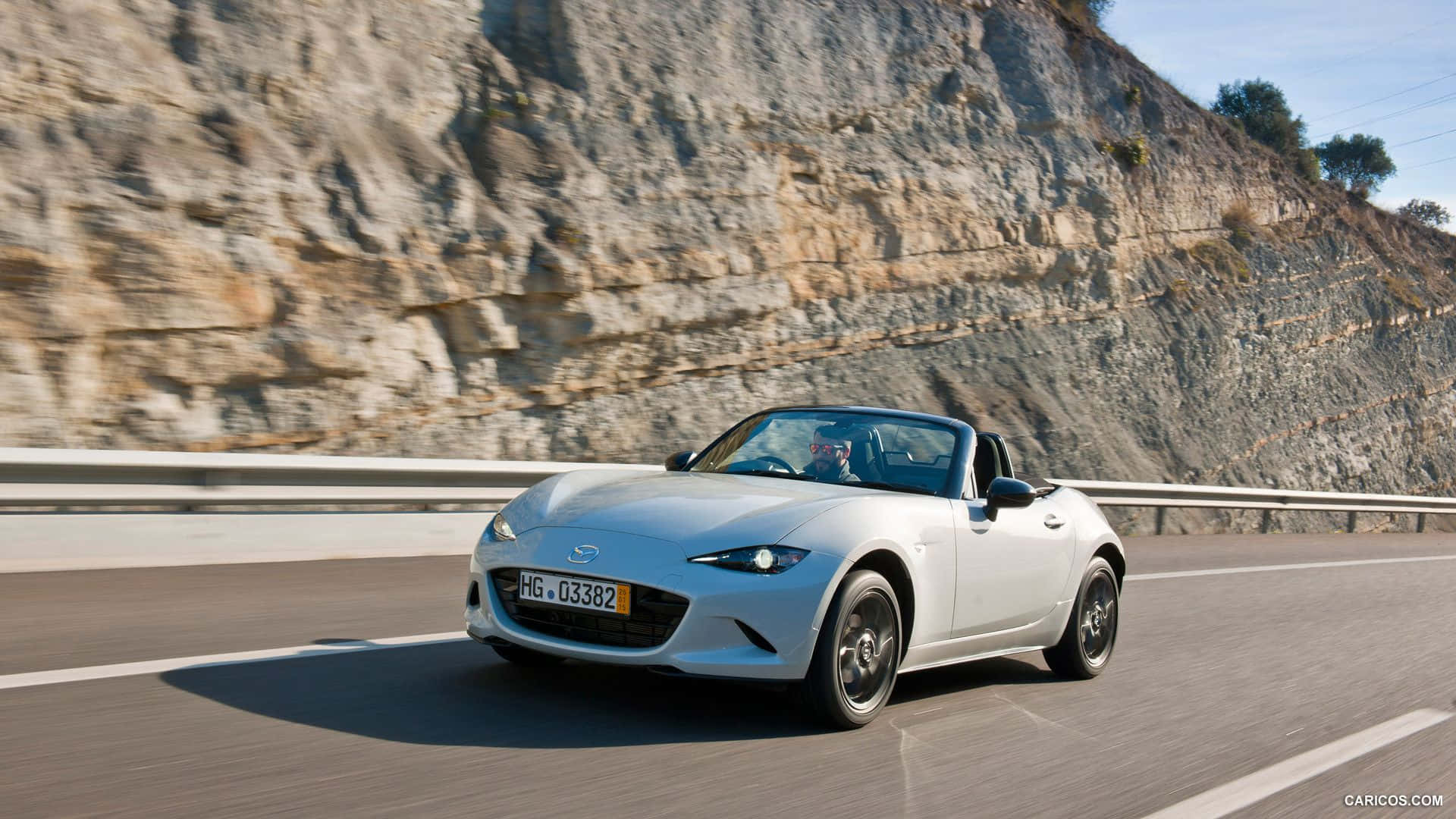 Enjoy The Wind-in-your-hair Freedom With Mazda Mx 5 Miata Background