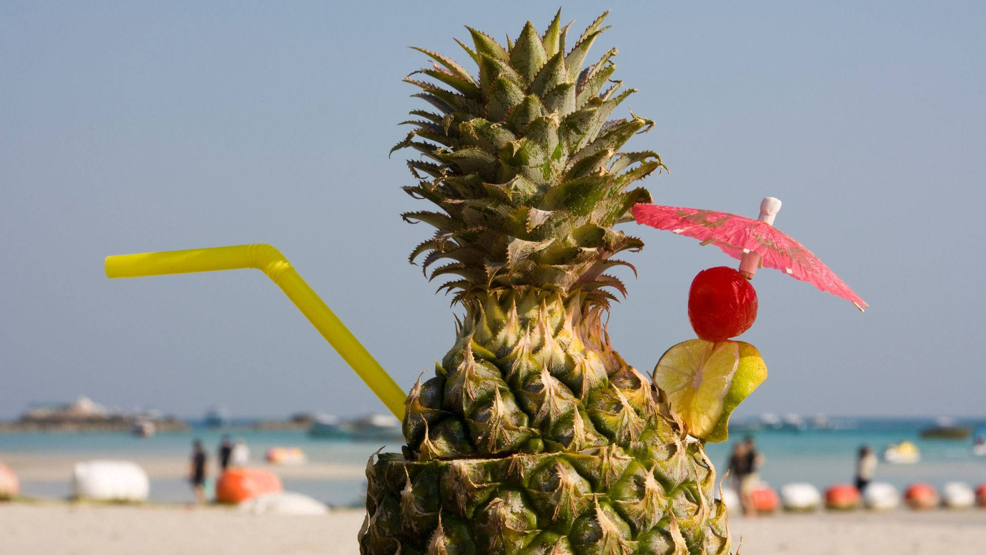 Enjoying A Pineapple Beach Cocktail On A Sunny Day Background