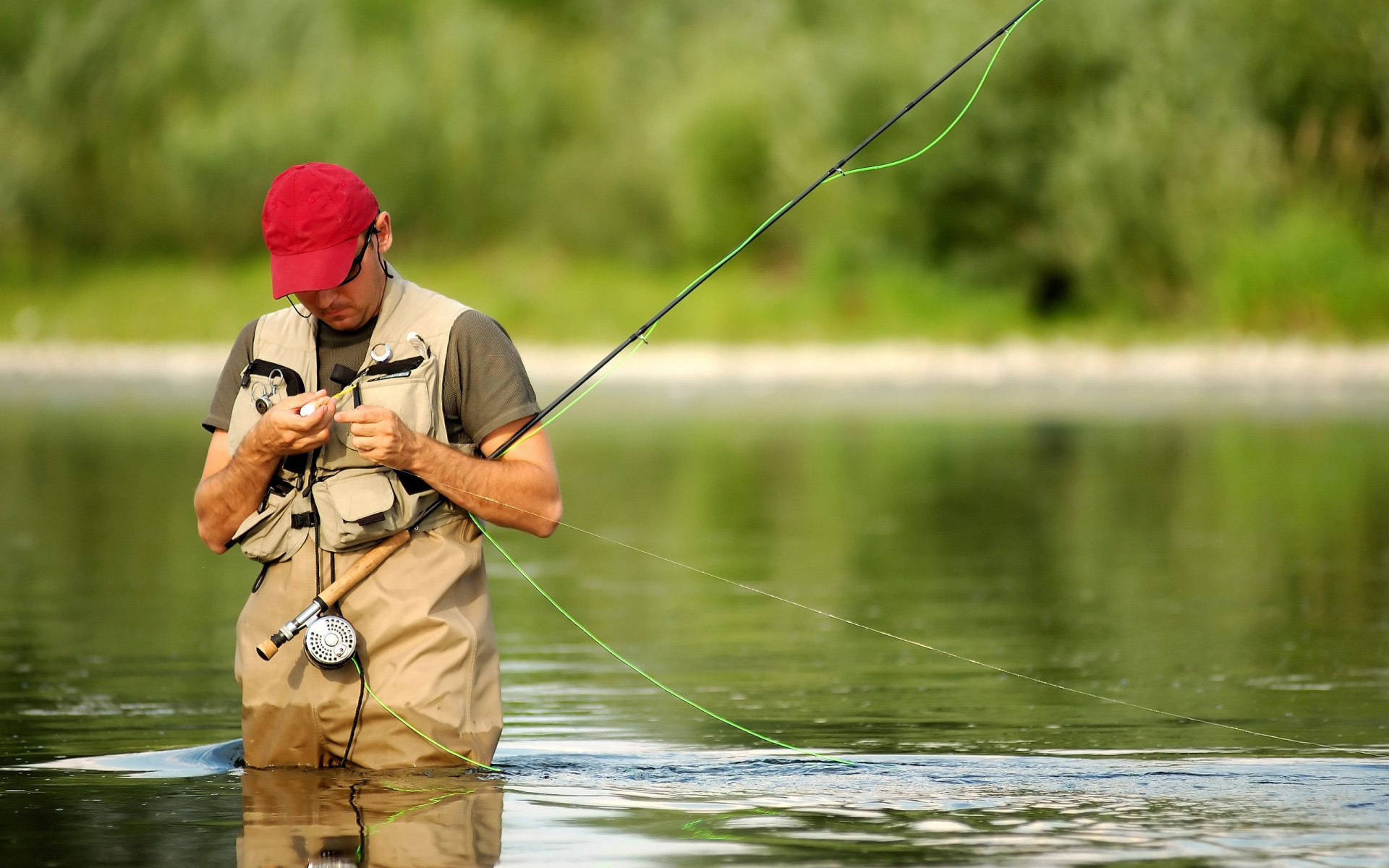 Enjoying An Afternoon Of Bass Fishing In The Lake Background