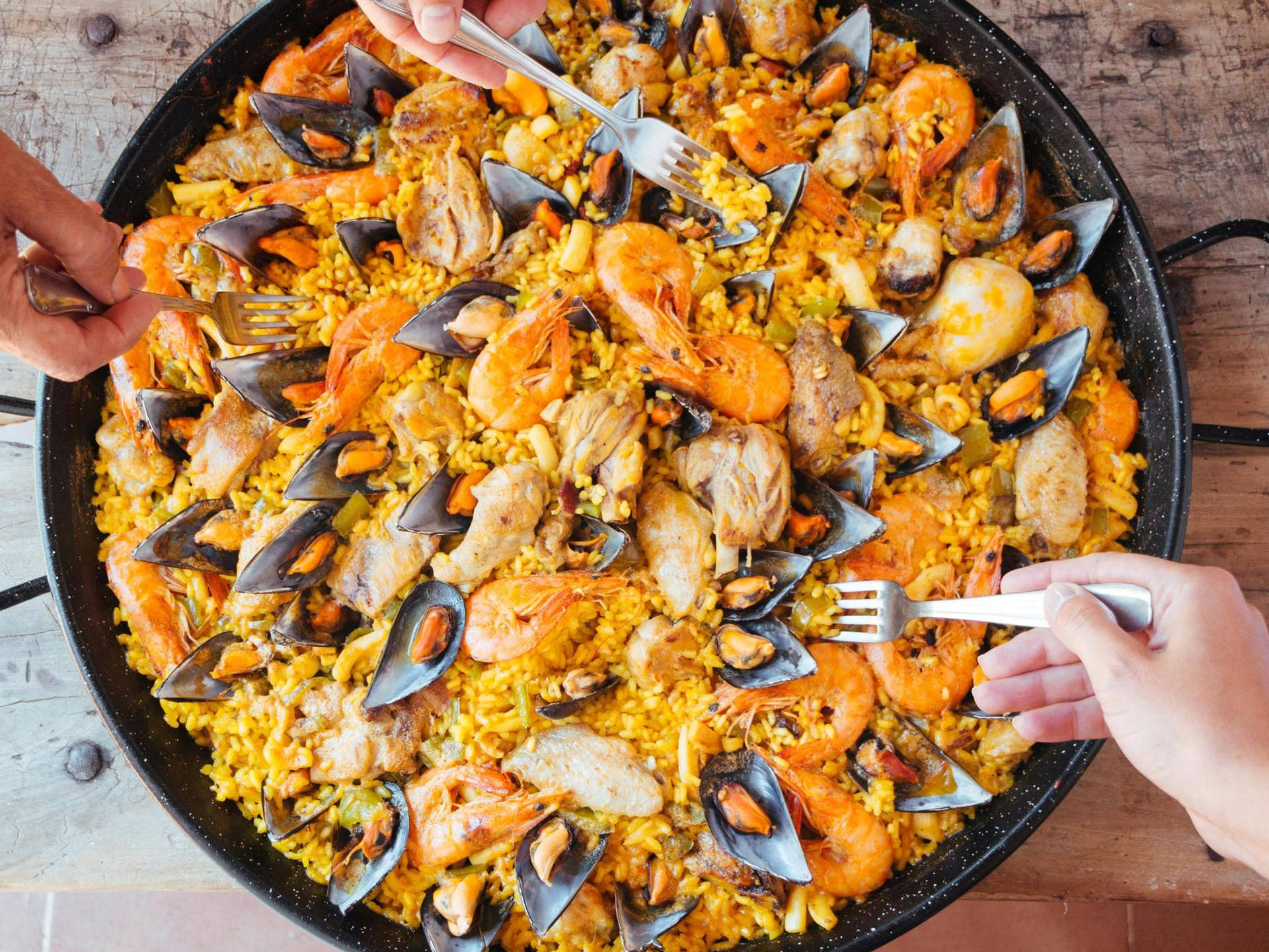 Enjoying Authentic Paella In Pan Background