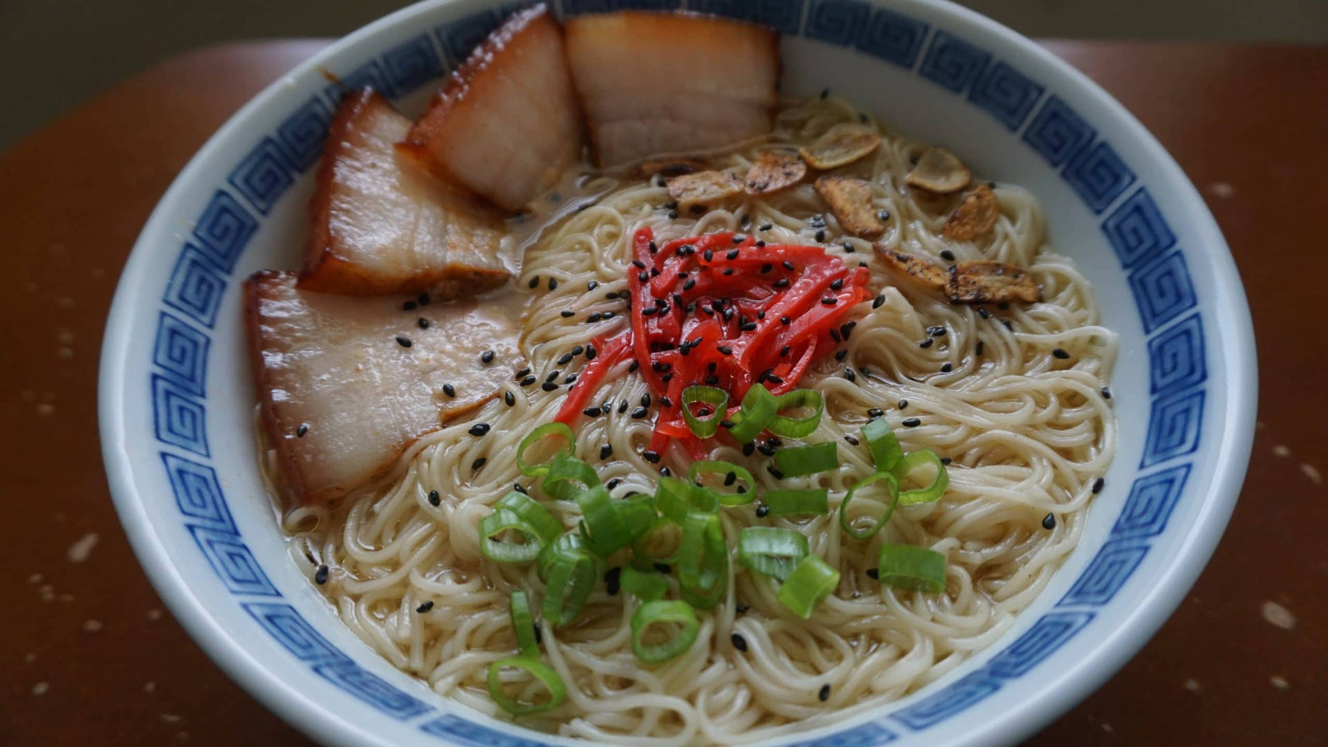 Enjoying Delicious Hakata Ramen With Thin Noodles Background