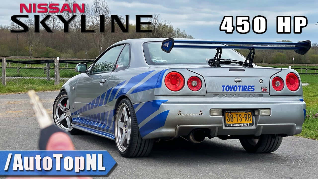 Enjoying The California Coastline In A Paul Walker-driven Nissan Skyline Background