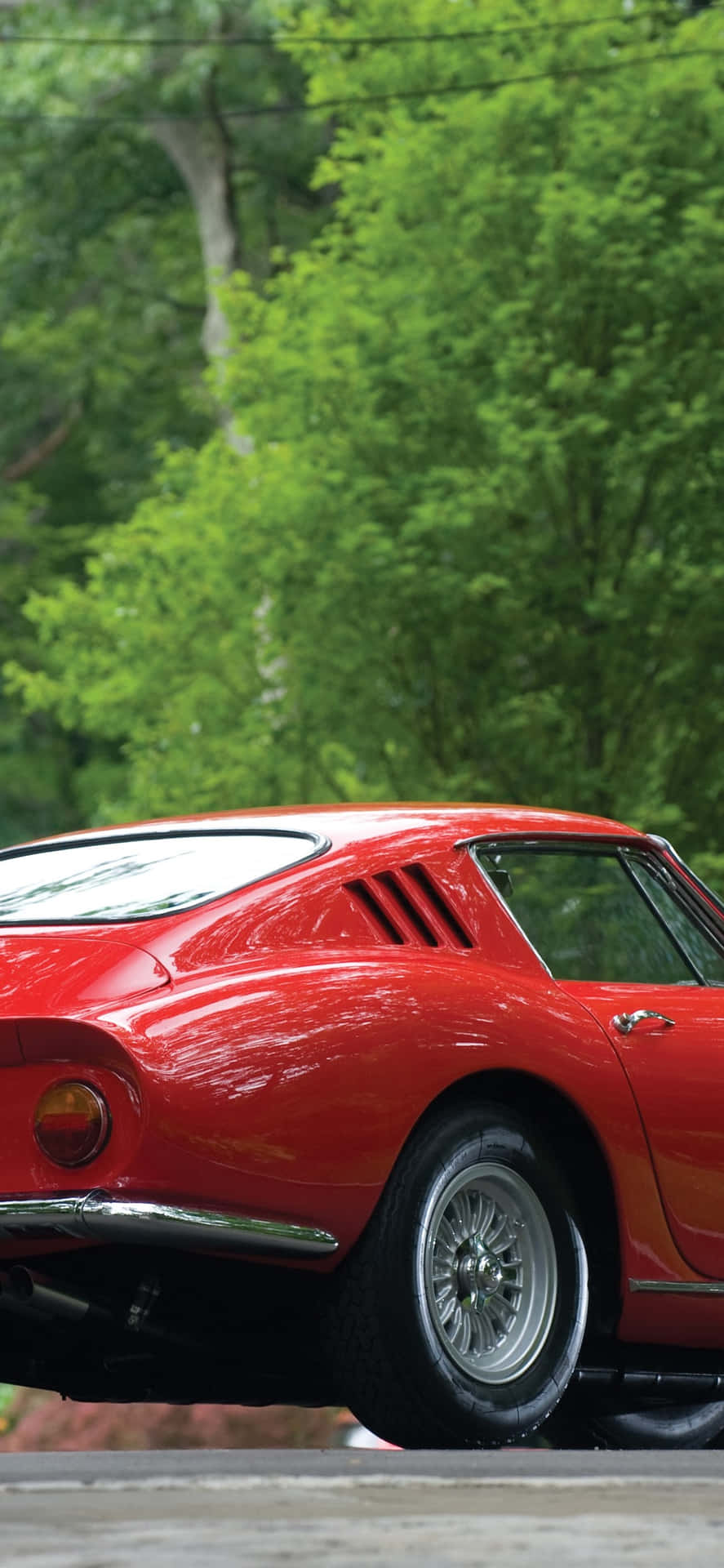 Enjoying The Ride In This Vintage Ferrari Background