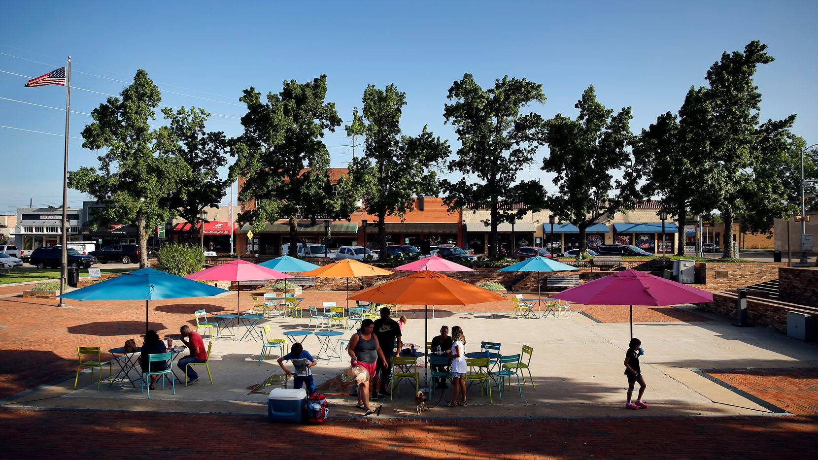 Enjoying The Sunlight In Downtown Garland Square Background