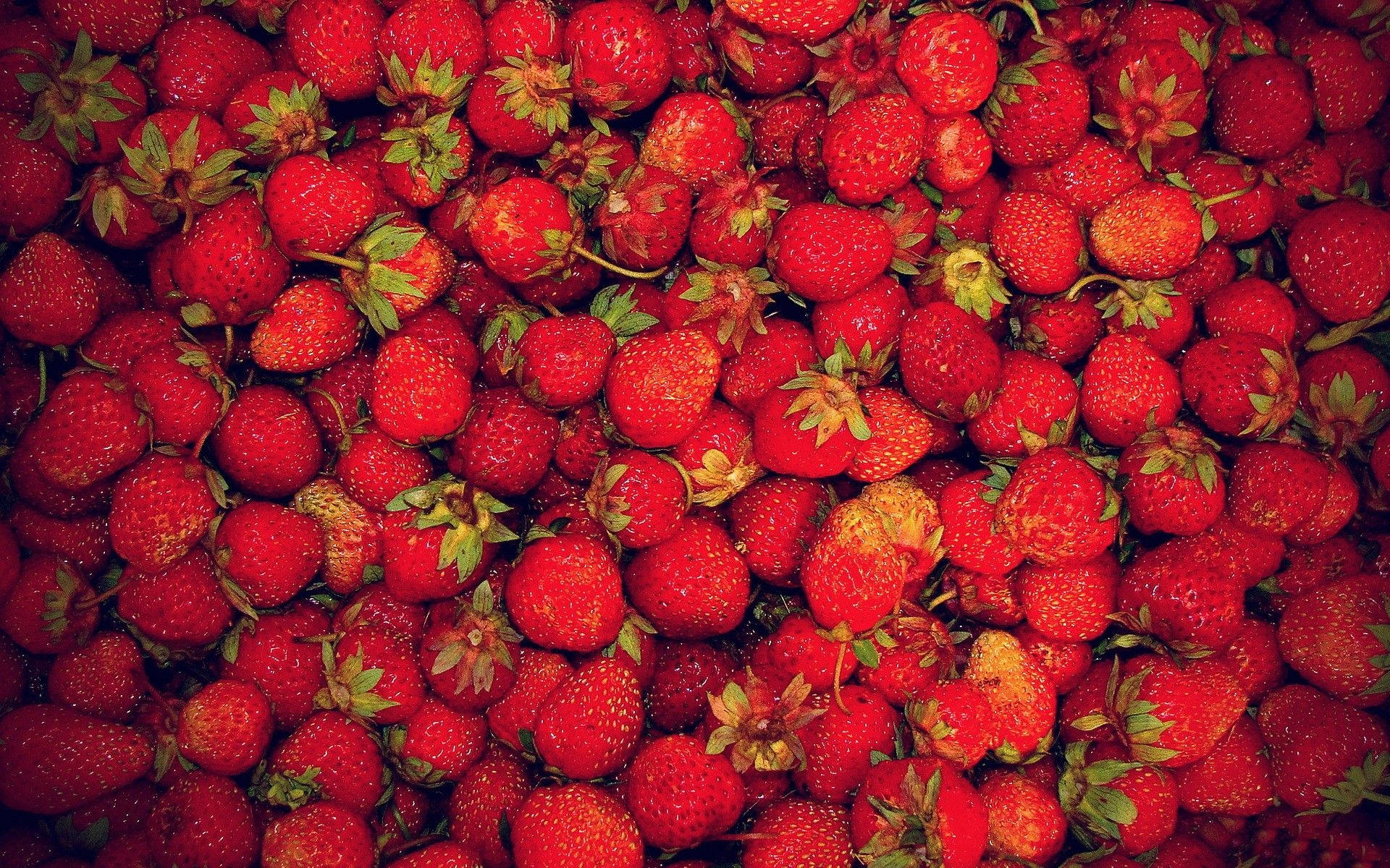 Enjoying The Sweet Aesthetic Of Strawberries Background