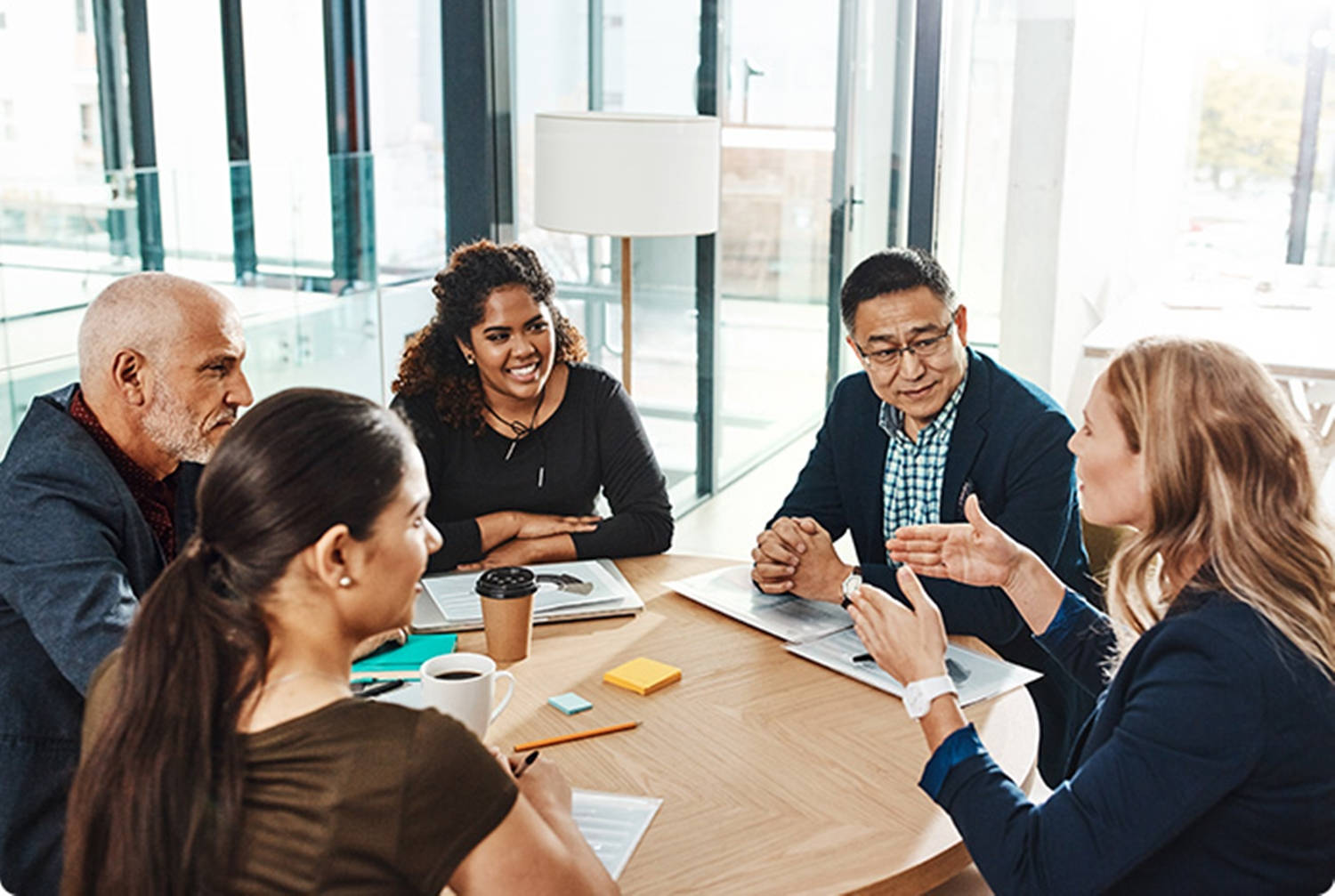 Enterprise Employees In A Business Meeting Background