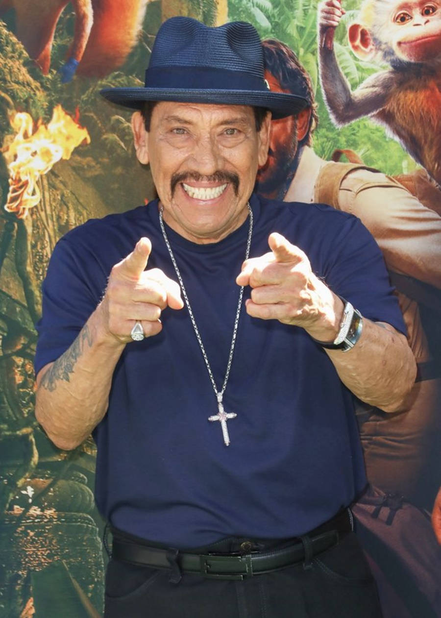 Enthusiastic Danny Trejo Pointing At The Camera Background