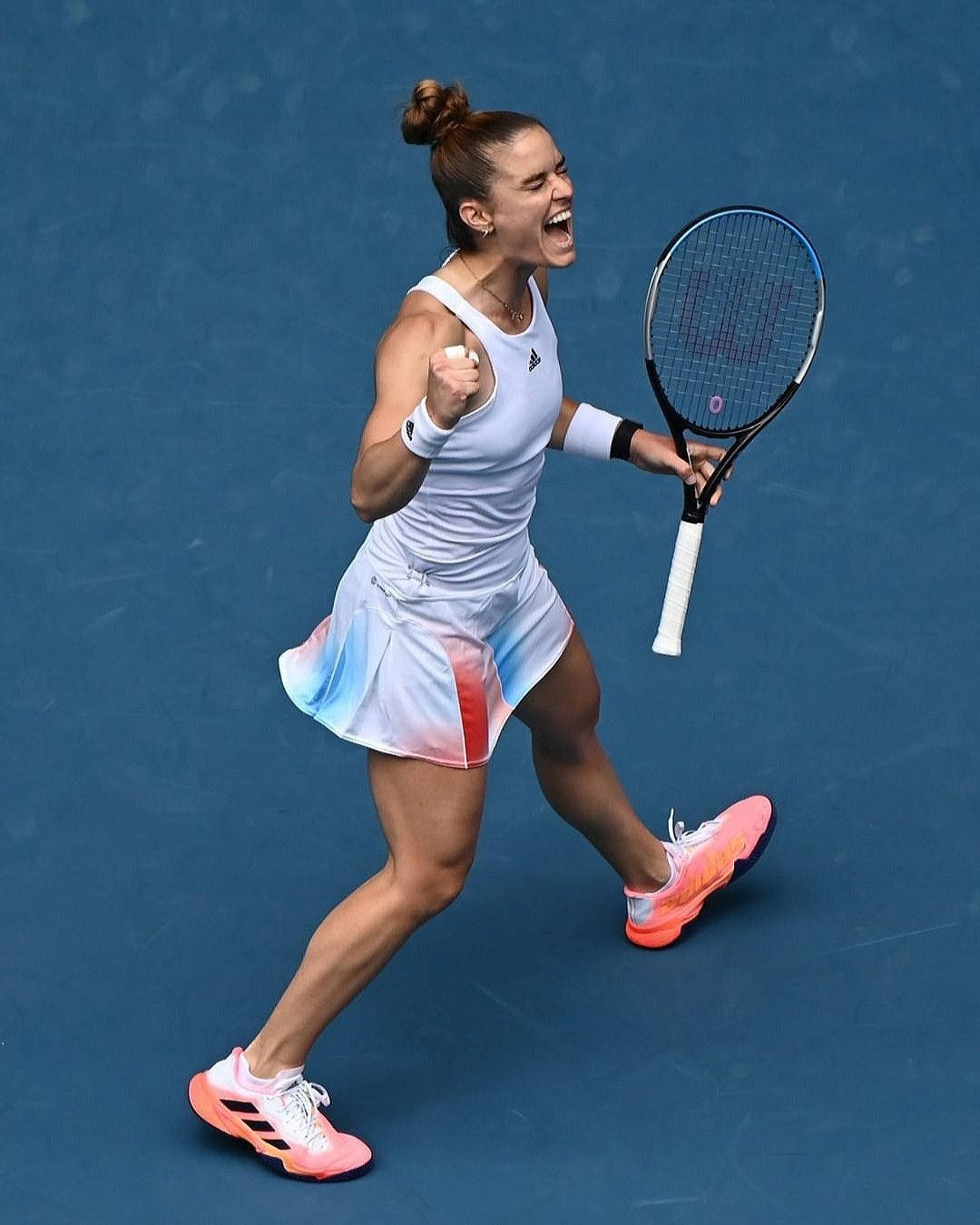 Enthusiastic Maria Sakkari Celebrating Victory On Court Background