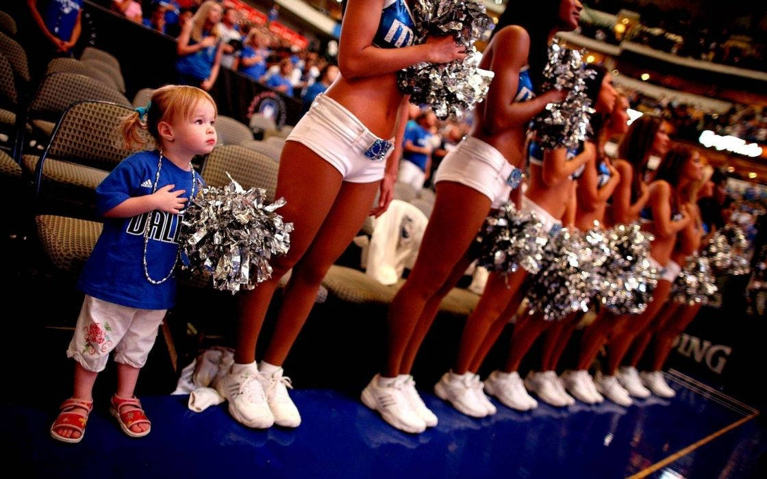 Enthusiastic Toddler Cheerleader In Action Background