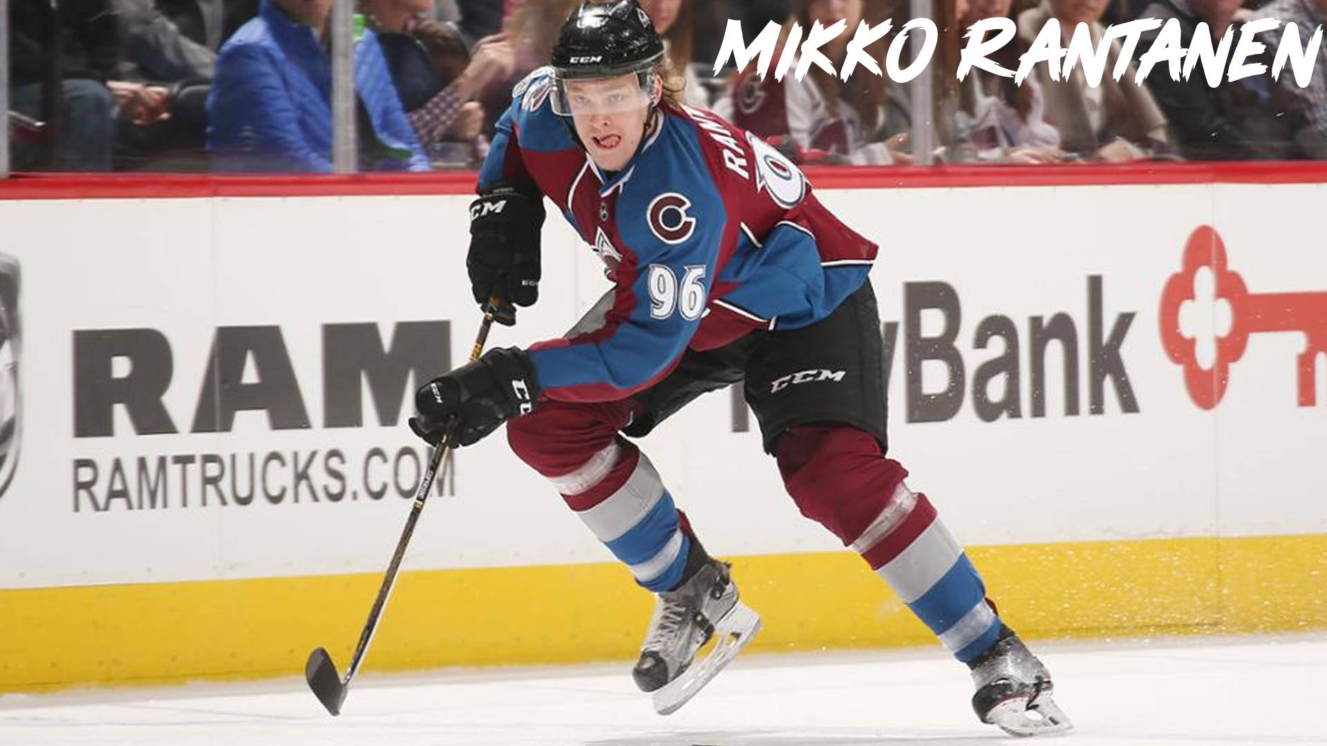 Enticing Snapshot Of Mikko Rantanen Cheekily Sticking Out His Tongue During An Intense Game Background