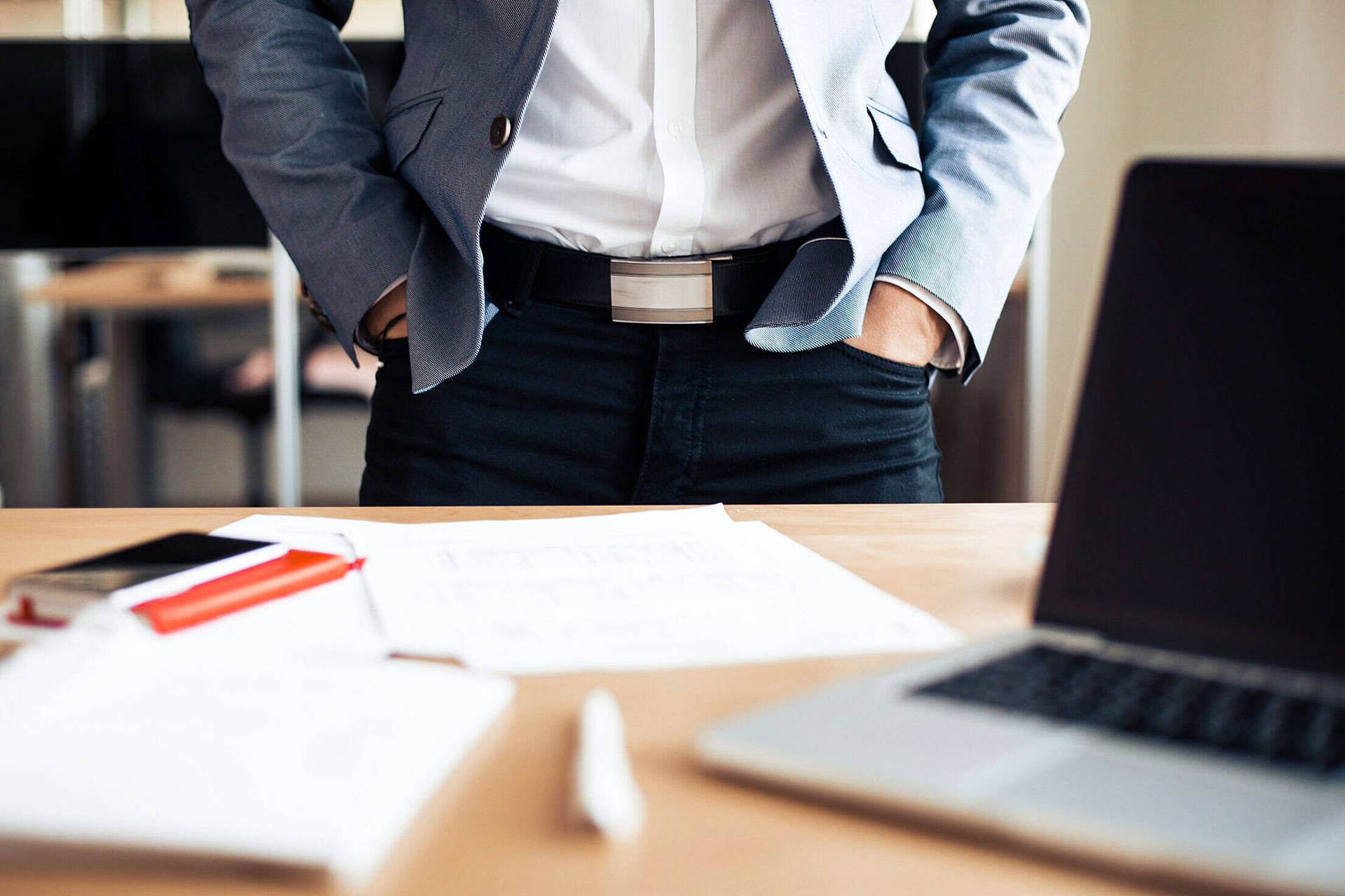 Entrepreneur At Work In Modern Office Background