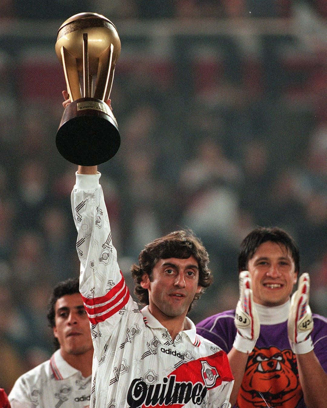 Enzo Francescoli Holding The Trophy Of Victory Background