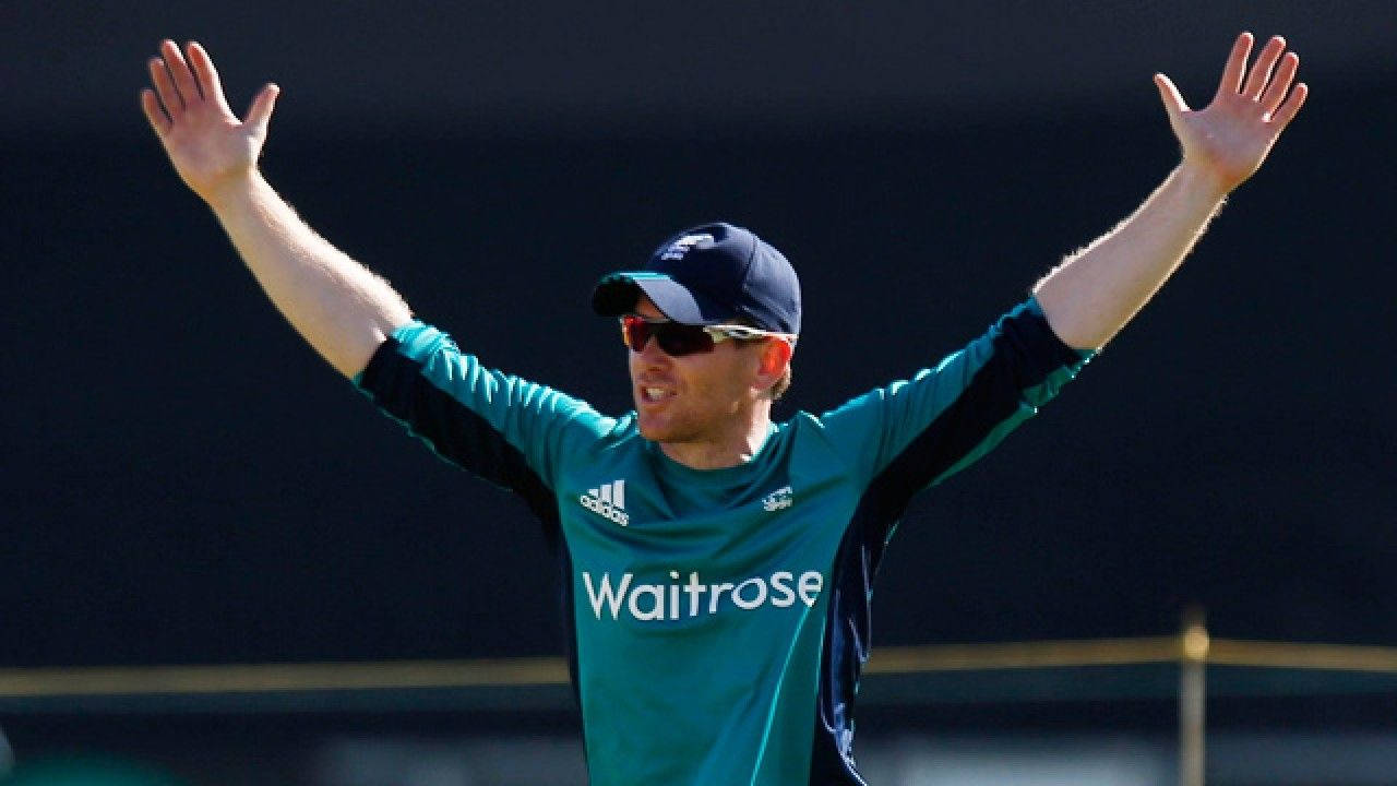 Eoin Morgan Hands Raised Background
