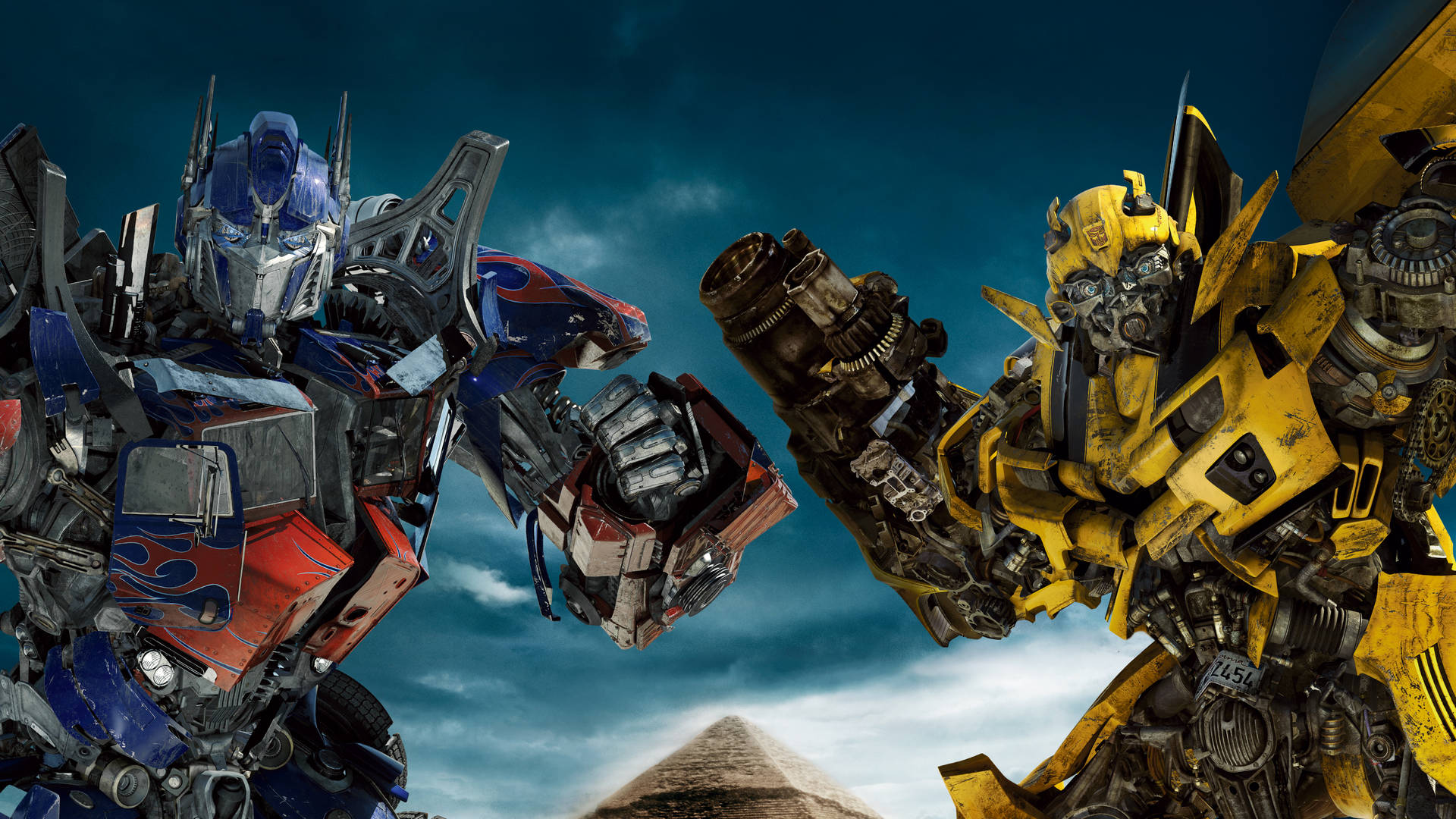 Epic Scene In 4k Ultra Hd Featuring Transformers Heroes Optimus Prime And Bumblebee Background