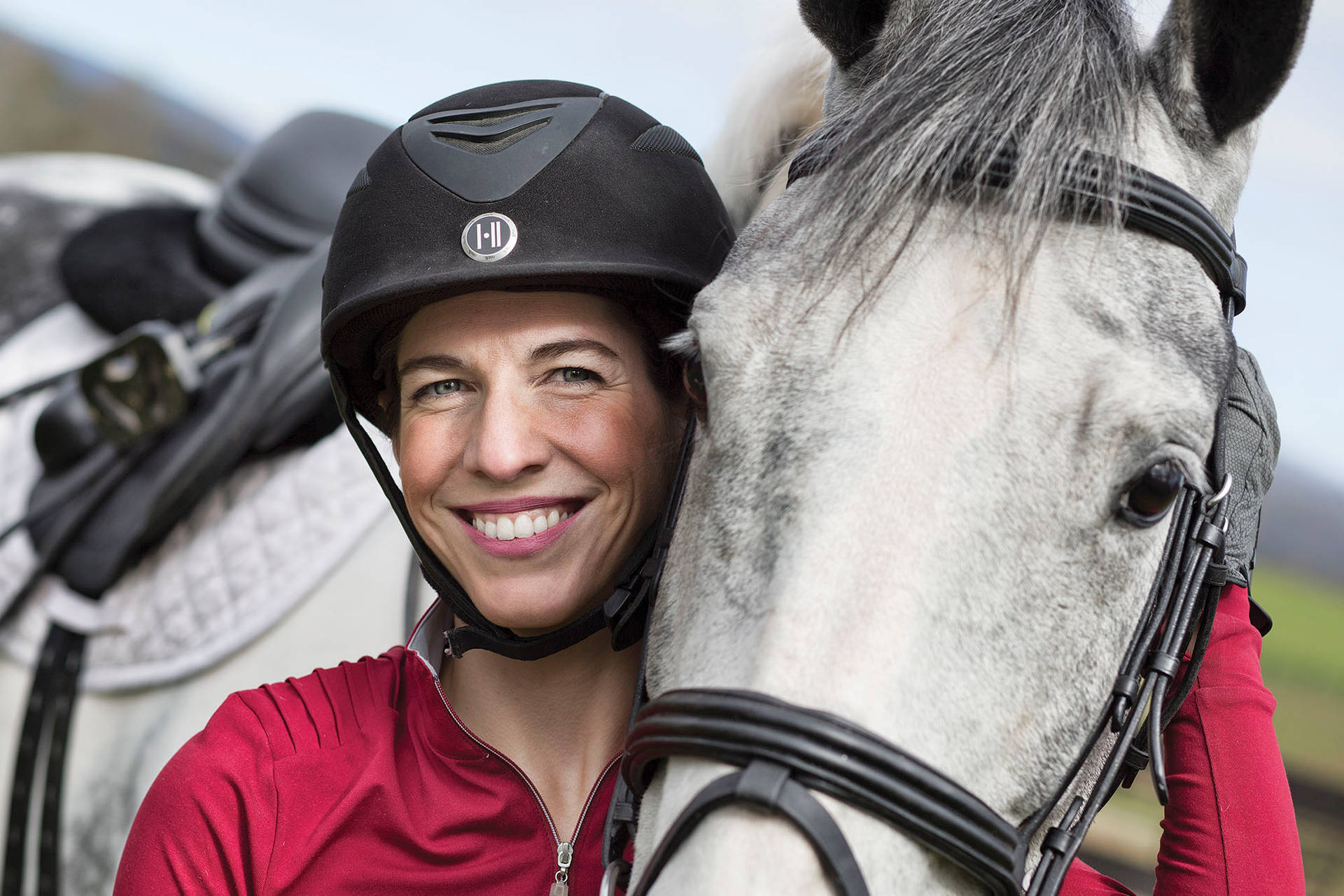 Equestrian Stephanie Bajo With White Horse Close Up Background