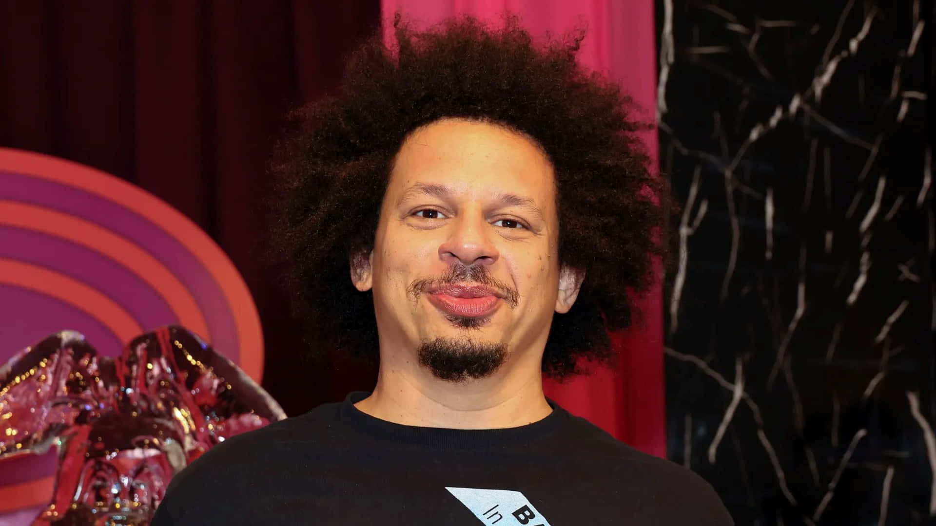 Eric Andre Comedic Pose Background