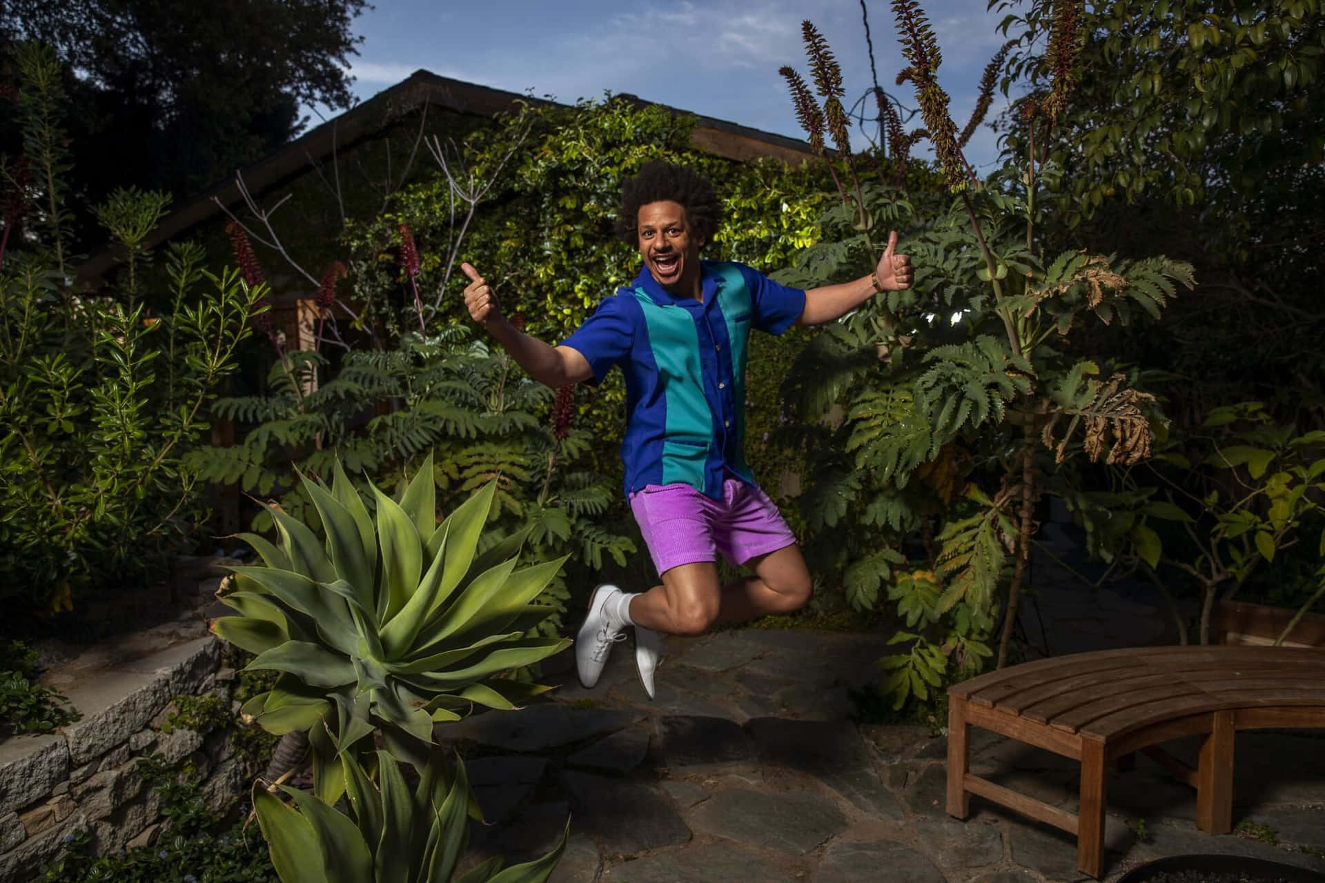 Eric Andre Jumping Garden Thumbs Up Background