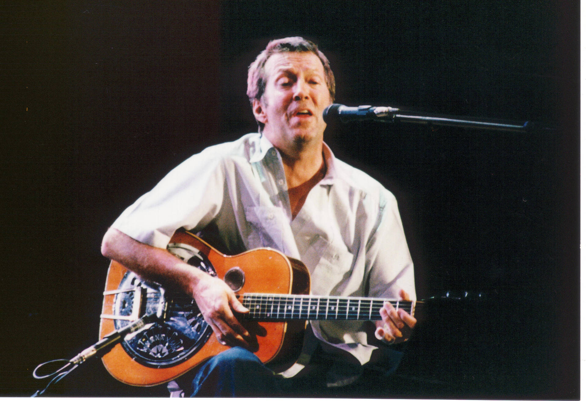 Eric Clapton Singing And Strumming Background