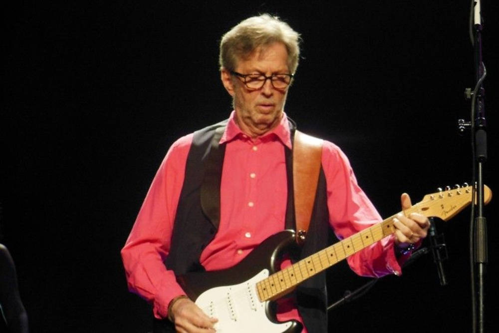 Eric Clapton Wearing Signature Black Vest Background