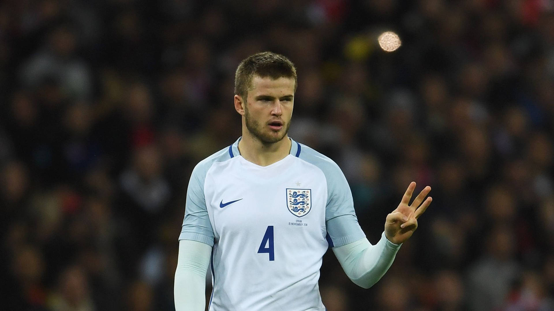 Eric Dier Holding Up Three Fingers Background