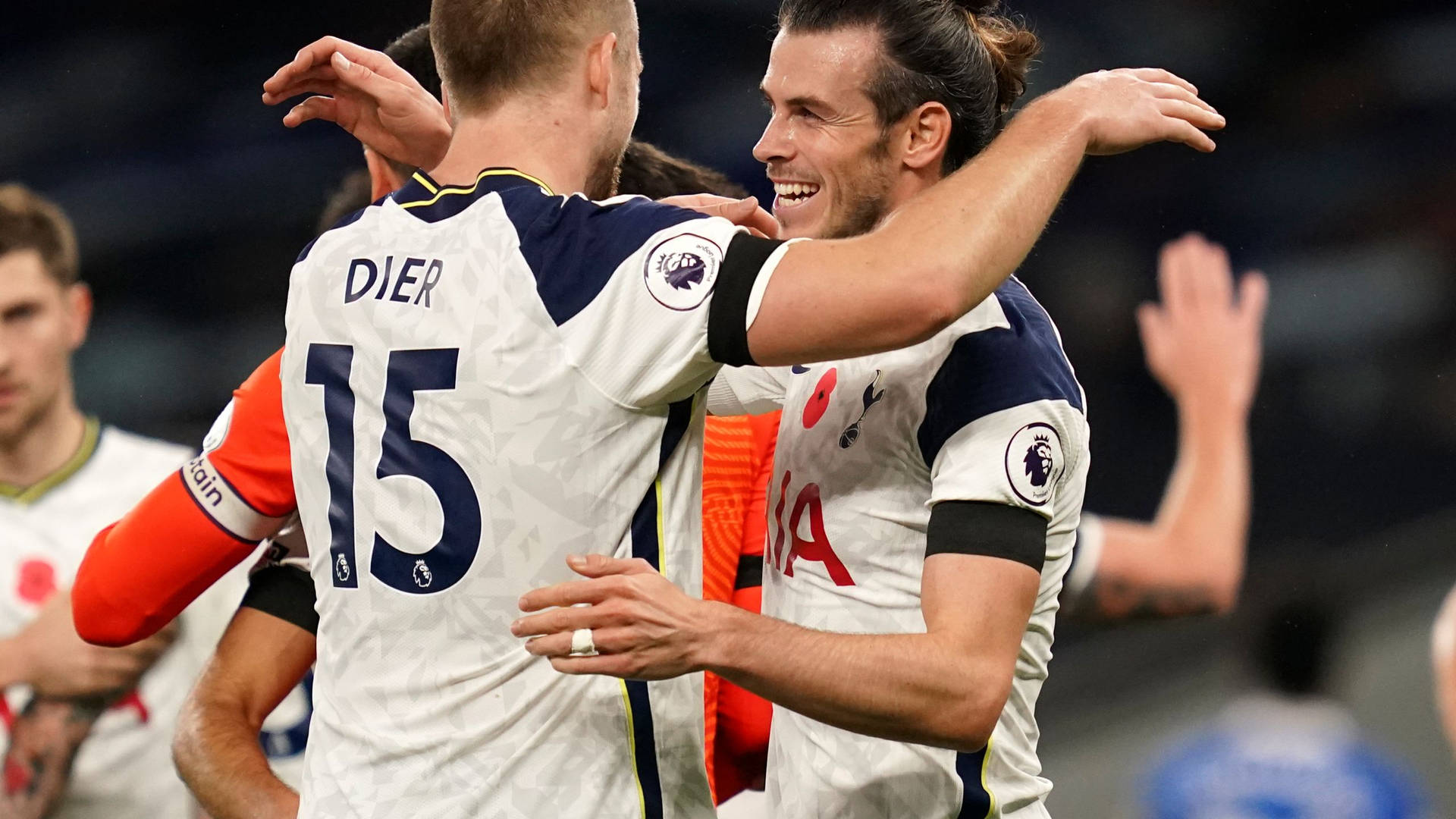 Eric Dier Hugging Teammate Background