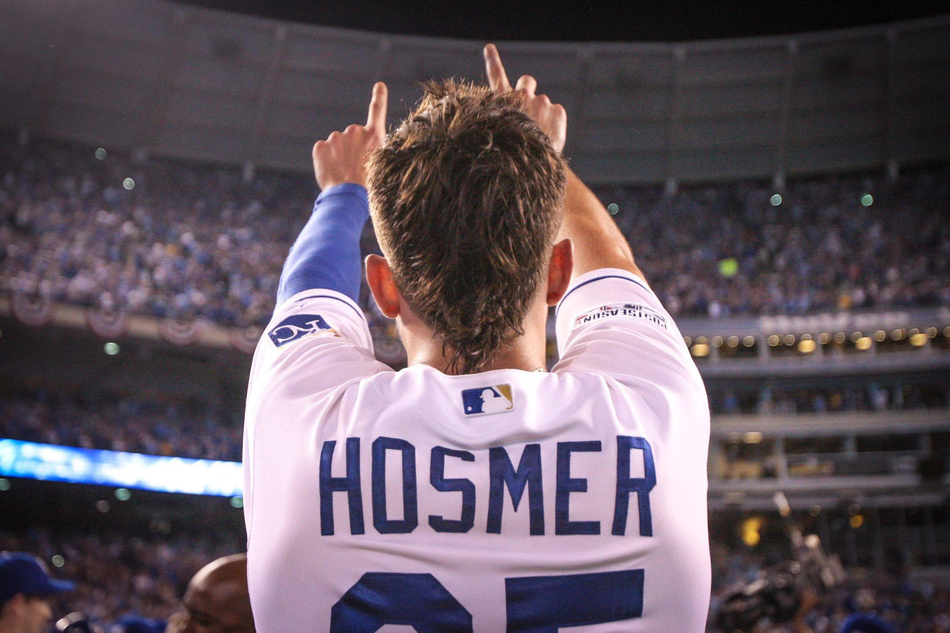 Eric Hosmer Raising Hand On The Crowd Background