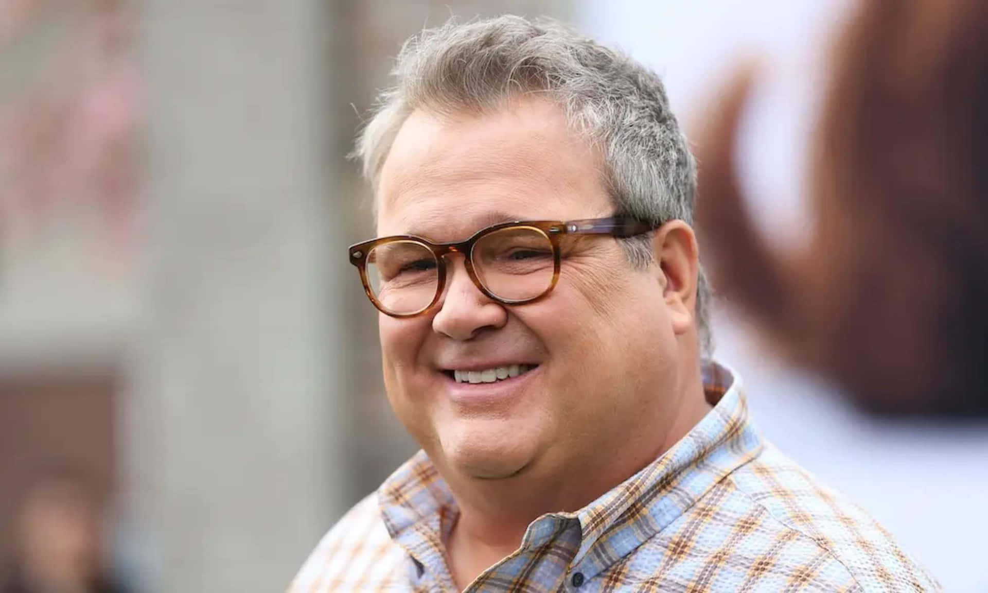 Eric Stonestreet In Casual Outfit Background