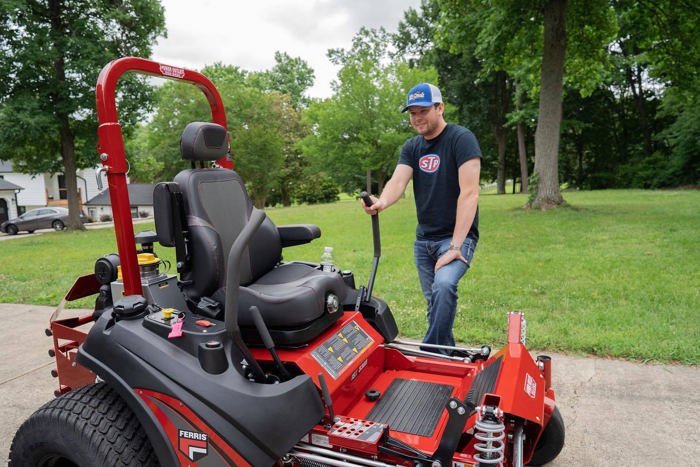 Erick Jones With A Red Commercial Lawn Mower