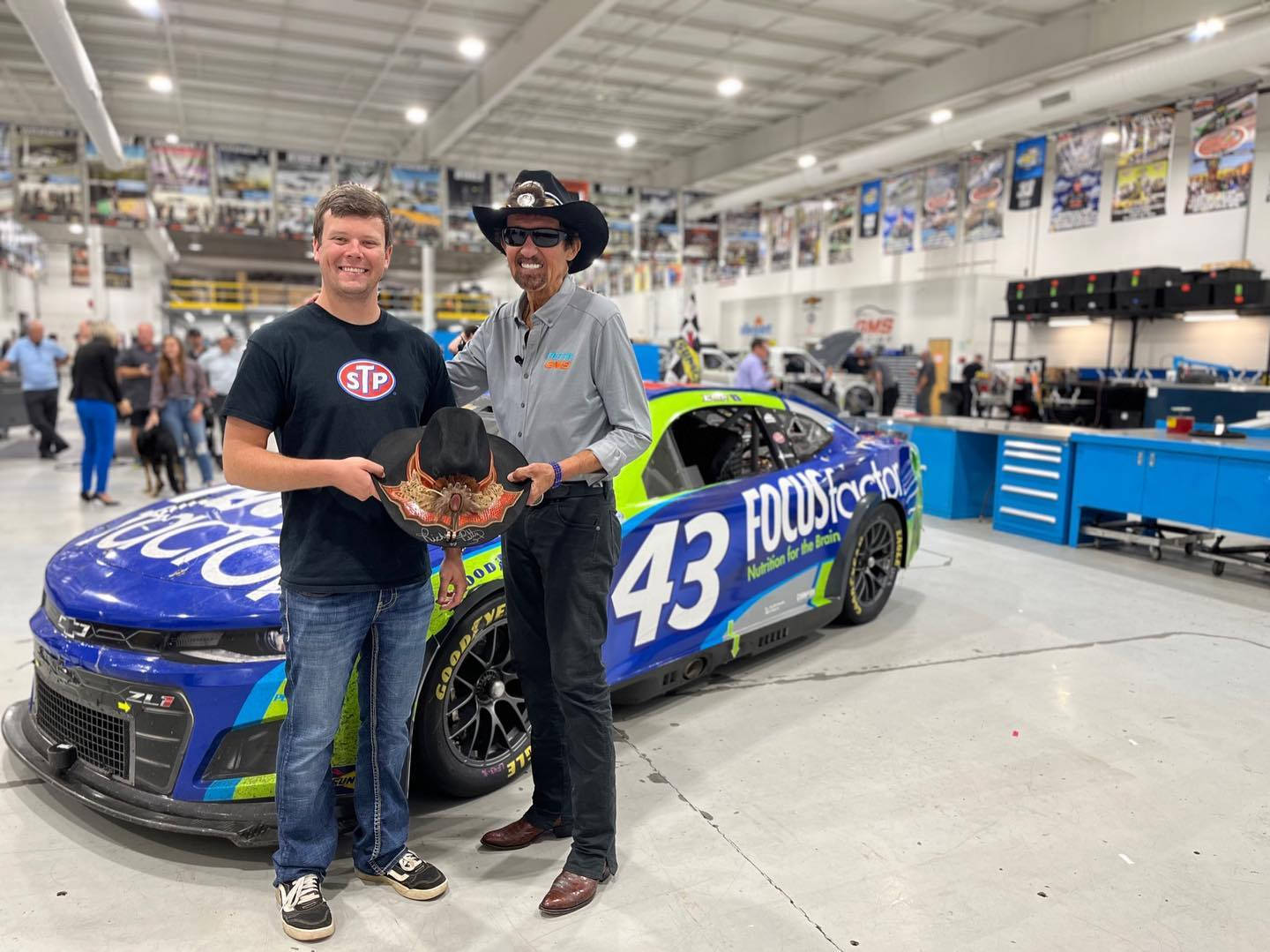 Erik Jones With A Man With Cowboy Hat