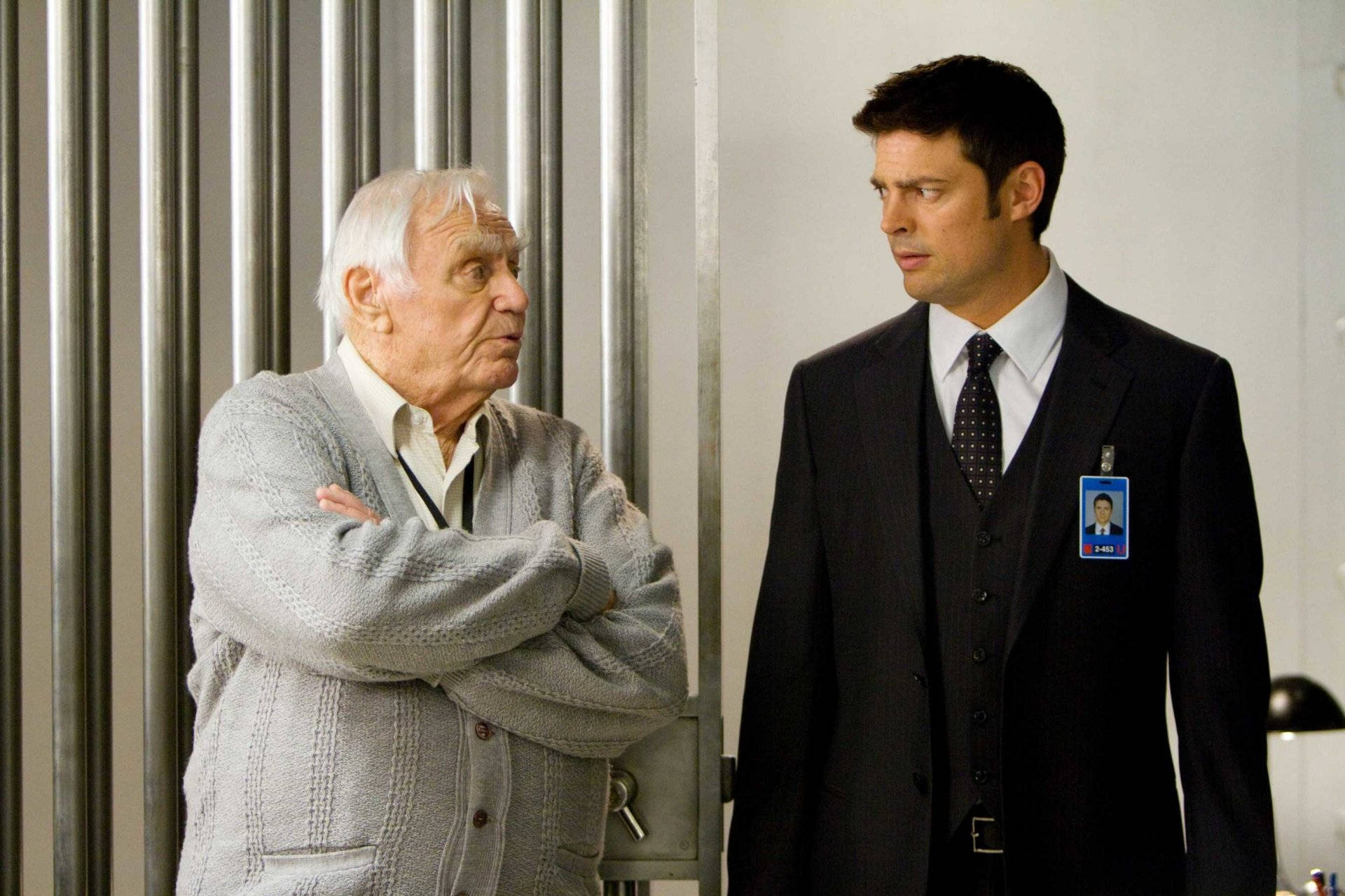 Ernest Borgnine And Karl Urban In Red Background