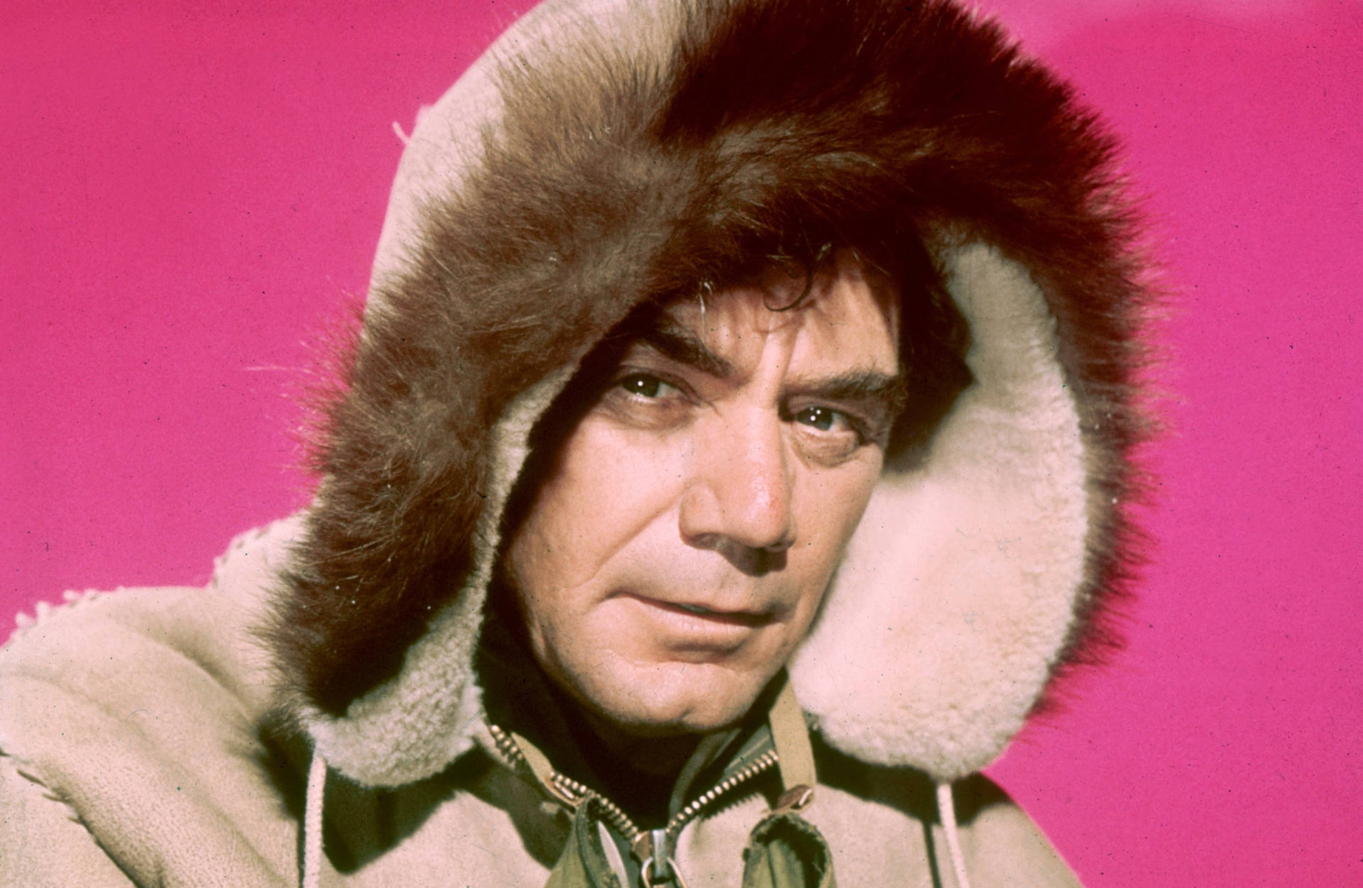 Ernest Borgnine In A Brown Fur Coat Background