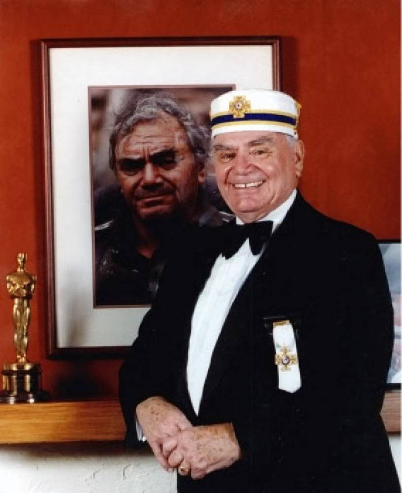 Ernest Borgnine With His Framed Portrait Background