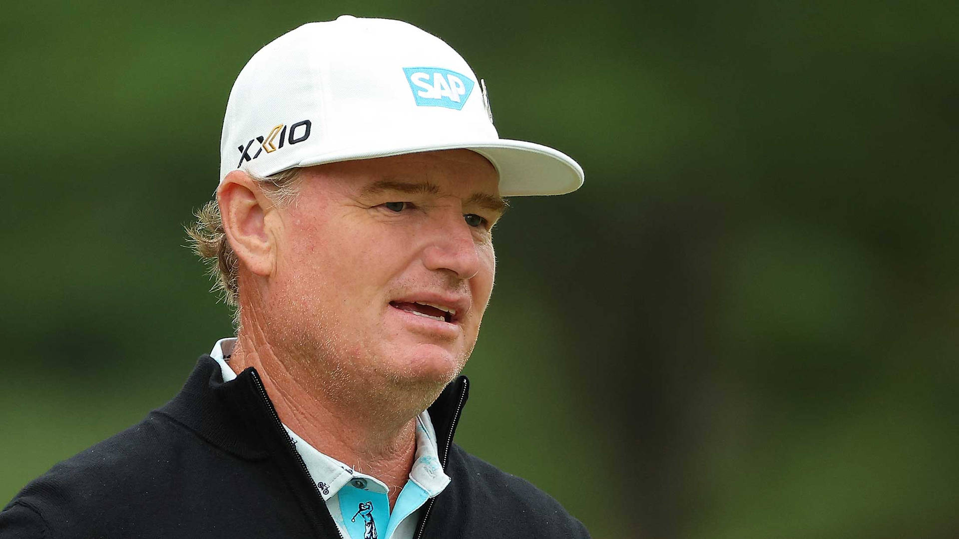 Ernie Els Close-up With Green Background Background