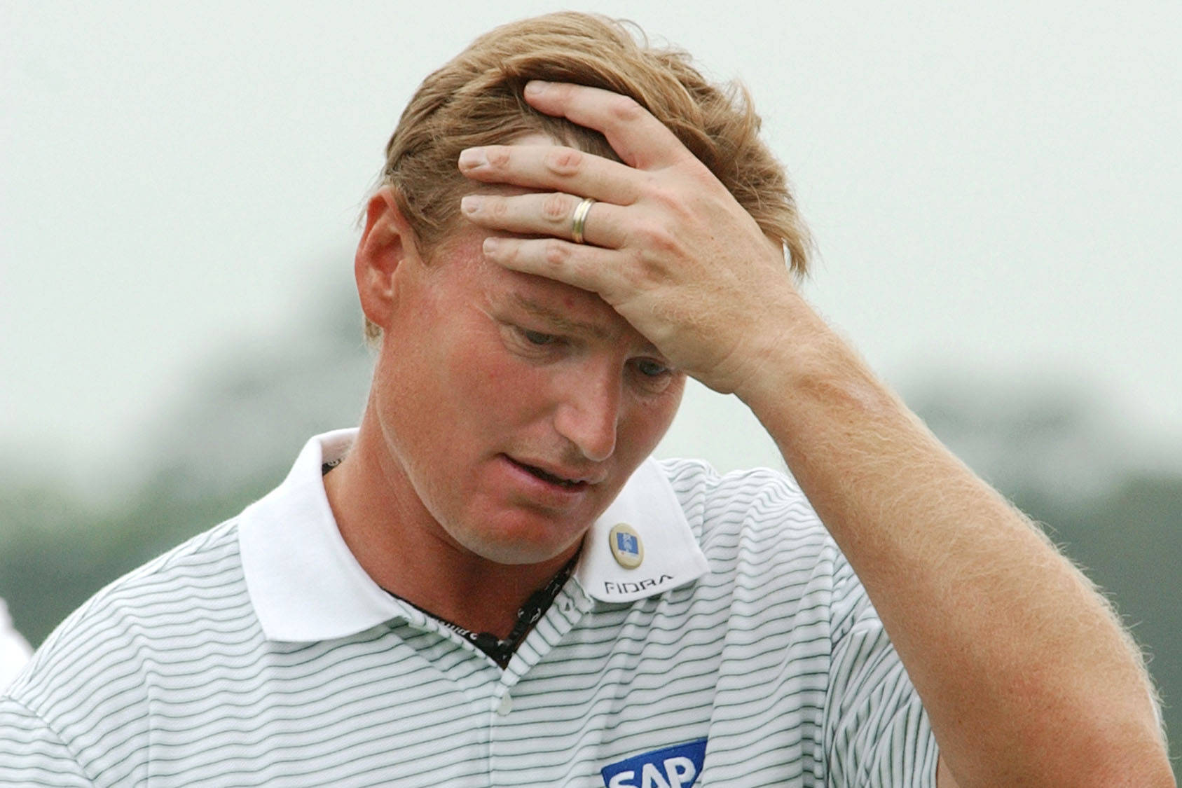 Ernie Els Hand On Forehead Background