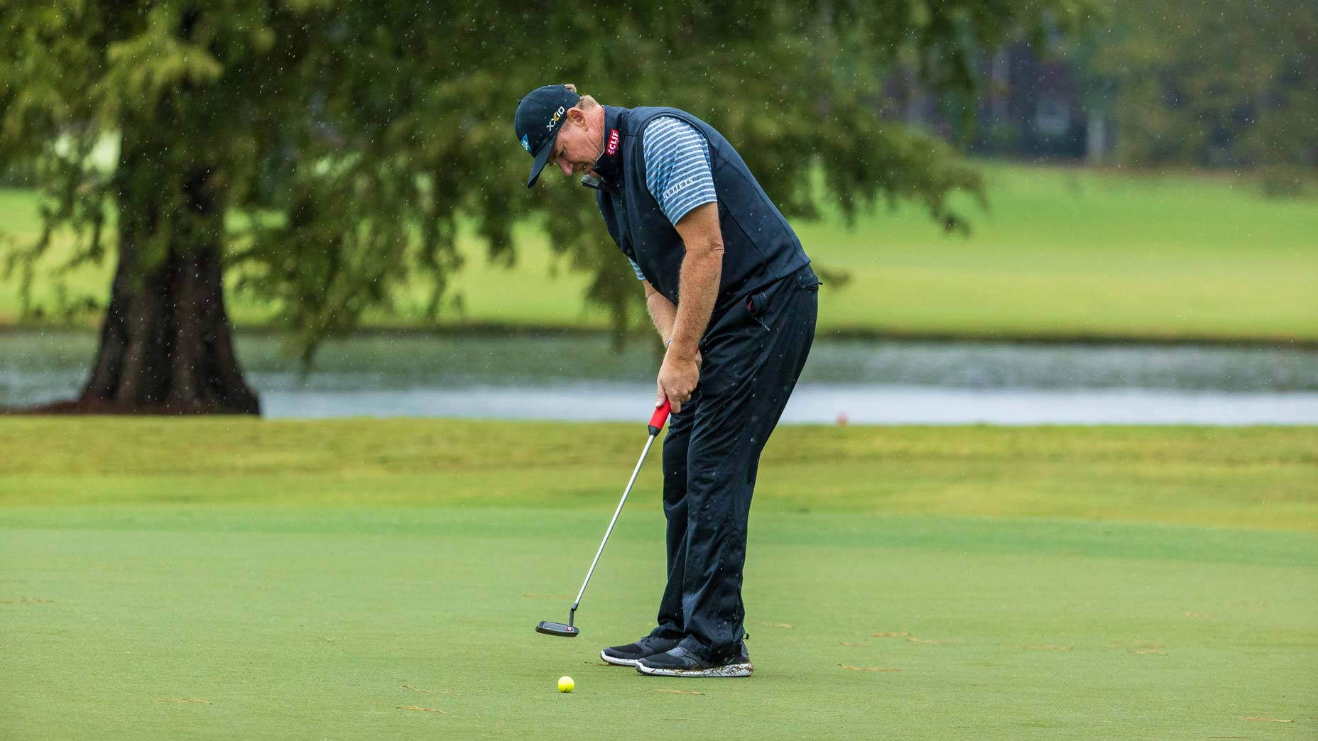 Ernie Els Intensely Focusing On His Swing On The Golf Course Background